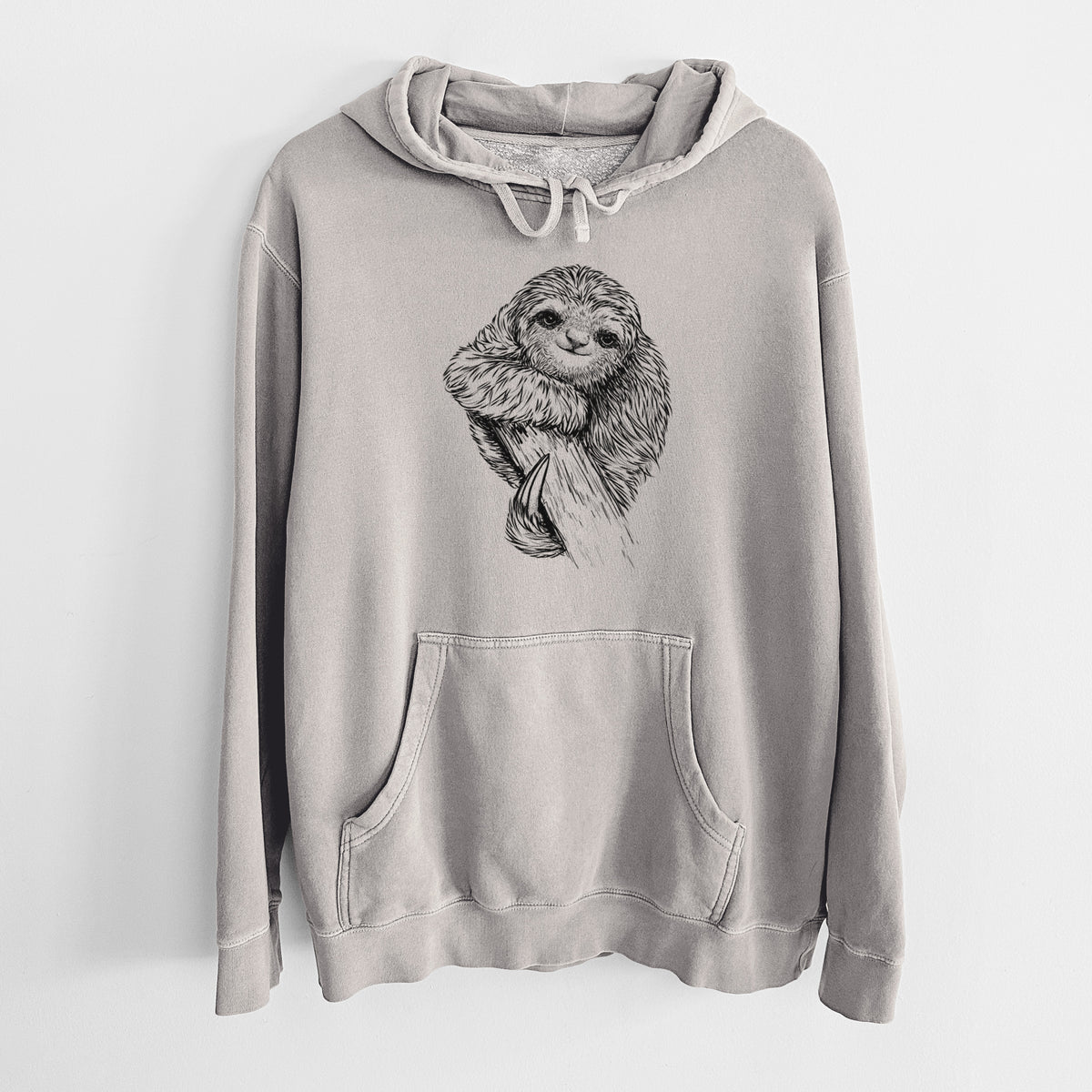 Cement grey pigment dyed hoodie laid flat, printed with a detailed black ink illustration of a smiling pygmy three-toed sloth hanging from a branch.