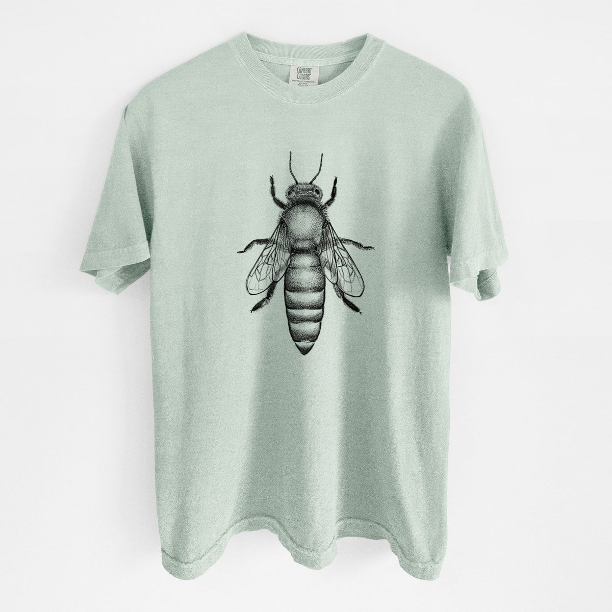 Bay green Comfort Colors t-shirt laid flat, printed with a detailed black ink illustration of a queen honey bee, seen from above.