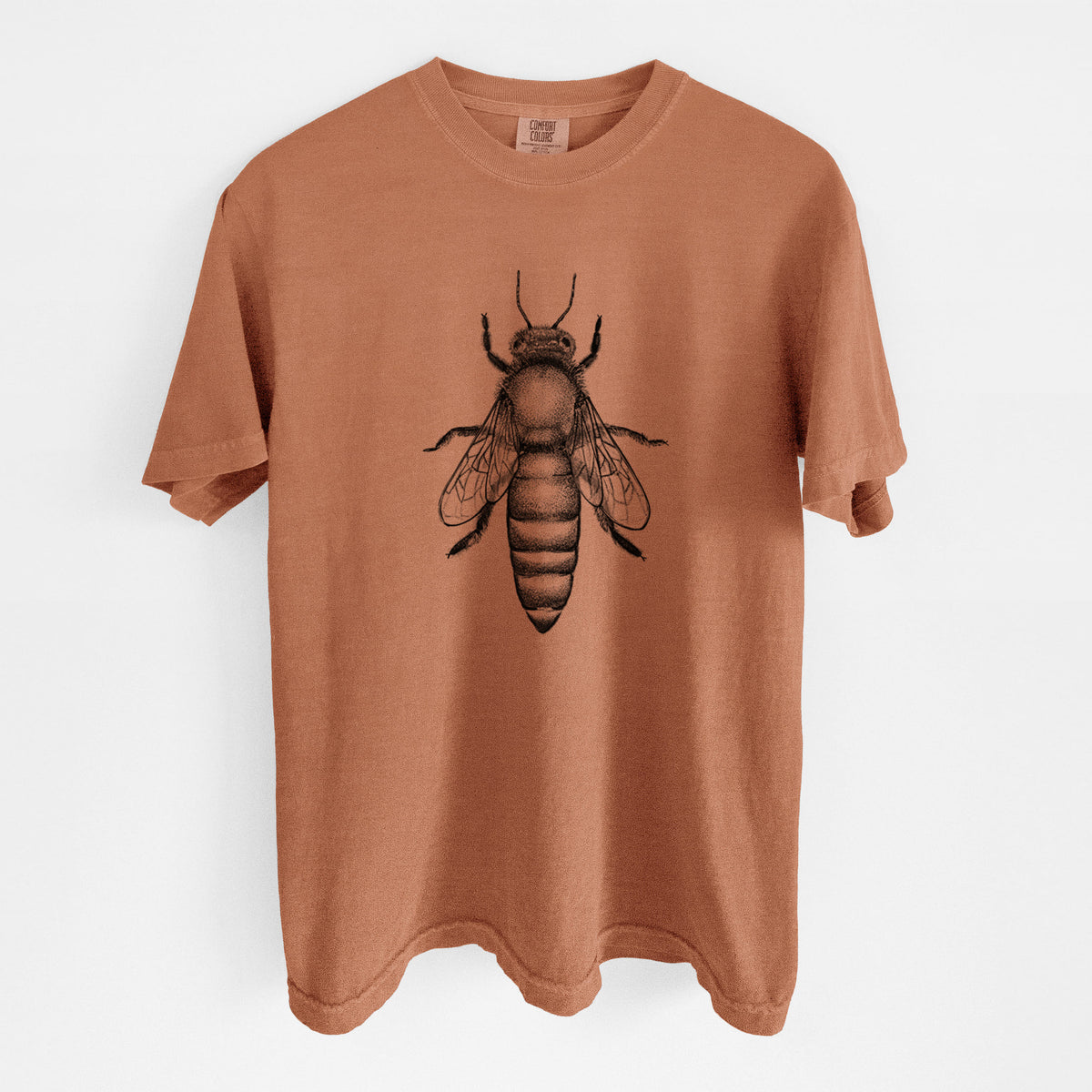 Yam burnt orange Comfort Colors t-shirt laid flat, printed with a detailed black ink illustration of a queen honey bee, seen from above.