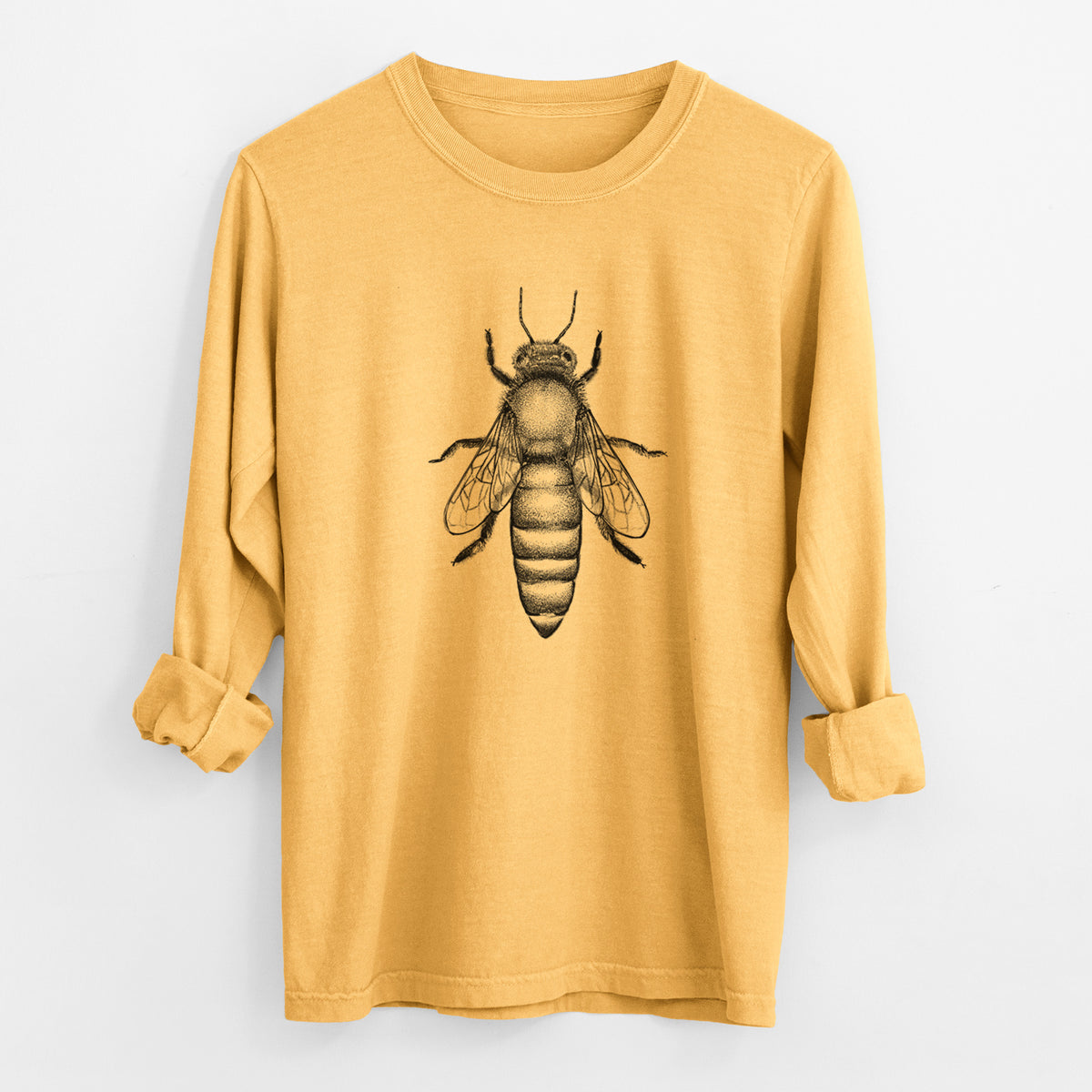 Golden wheat yellow Comfort Colors long sleeve shirt laid flat with the cuffs rolled, printed with a detailed black ink illustration of a queen honey bee, seen from above.