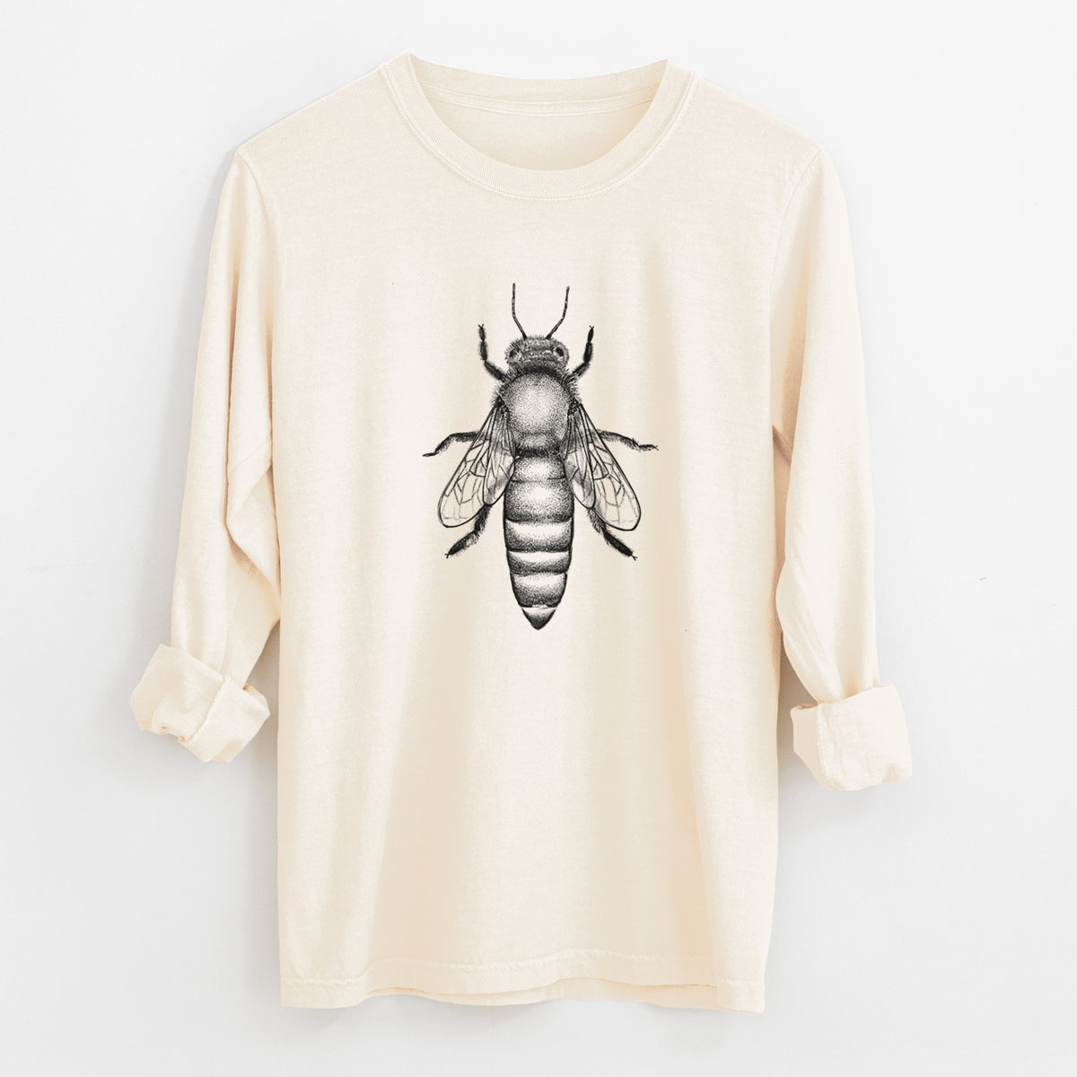 Ivory Comfort Colors long sleeve shirt laid flat with the cuffs rolled, printed with a detailed black ink illustration of a queen honey bee, seen from above.