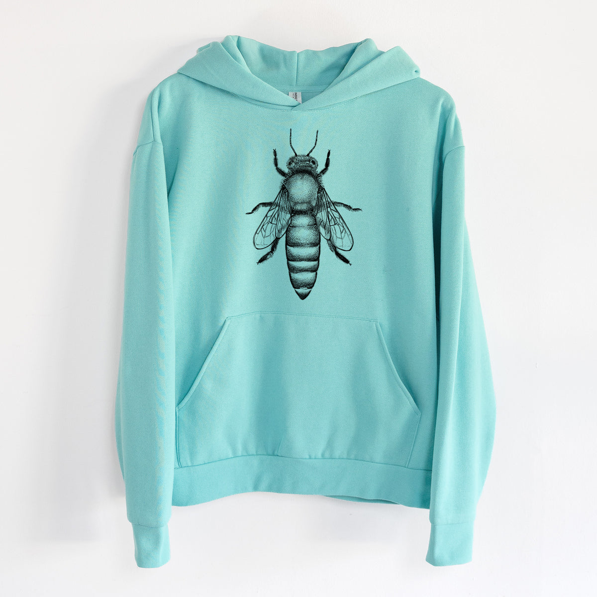Queen Bee Apis Mellifera - Statement Midweight Hoodie in Seafoam, hanging on a white wall, with a front kangaroo pocket and no drawcords.