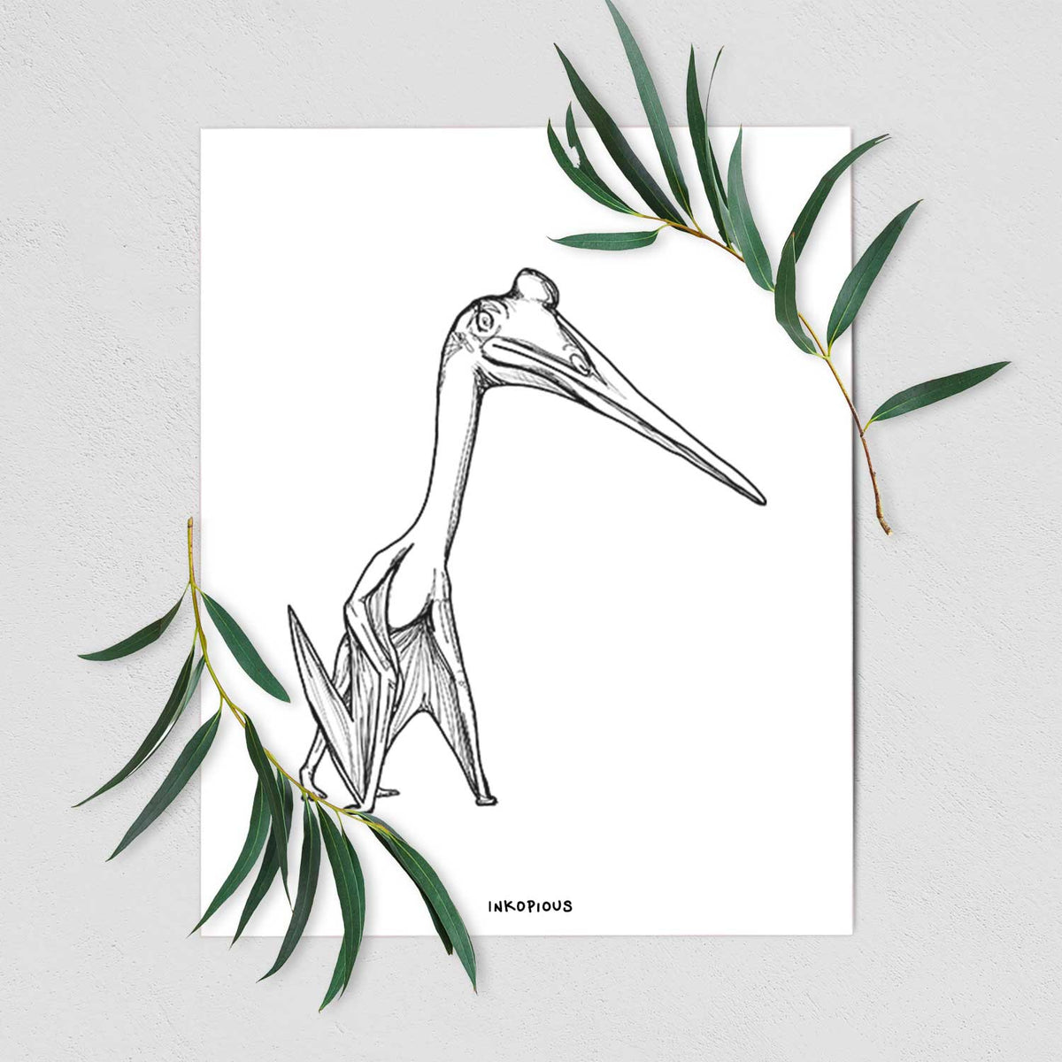 Art print of a black ink illustration of a Quetzalcoatlus pterosaur standing on all fours, shown with eucalyptus leaves.
