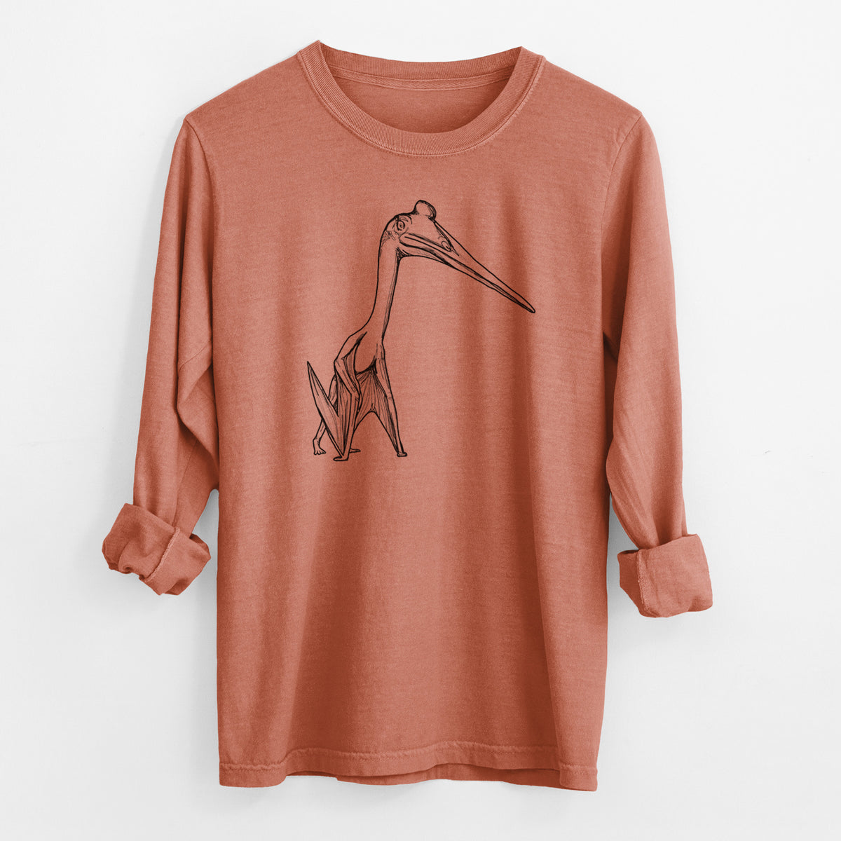 Yam burnt orange Comfort Colors long sleeve shirt laid flat with the cuffs rolled, printed with a black ink illustration of a Quetzalcoatlus pterosaur standing on all fours.