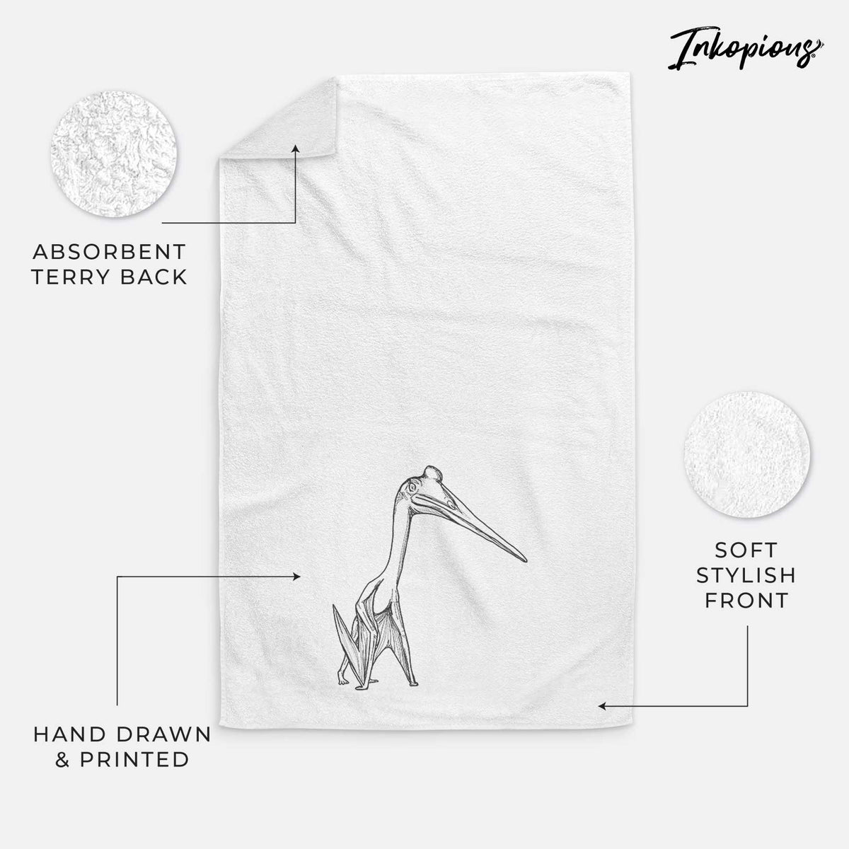 White hand towel printed with a black ink illustration of a Quetzalcoatlus pterosaur standing on all fours.
