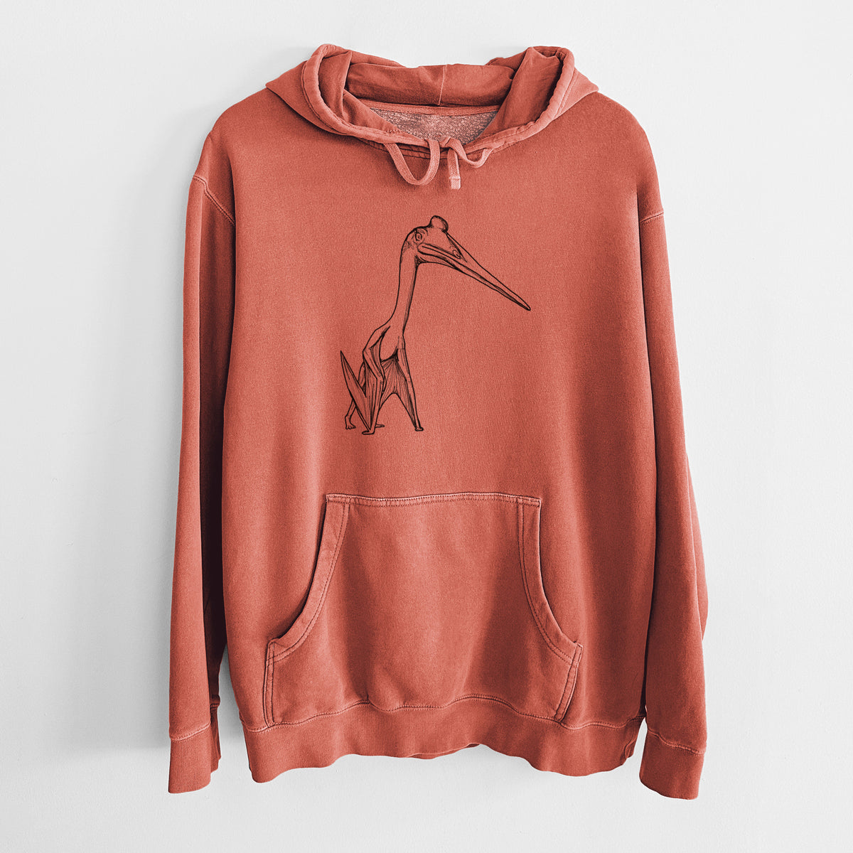 Amber orange pigment dyed hoodie laid flat, printed with a black ink illustration of a Quetzalcoatlus pterosaur standing on all fours.