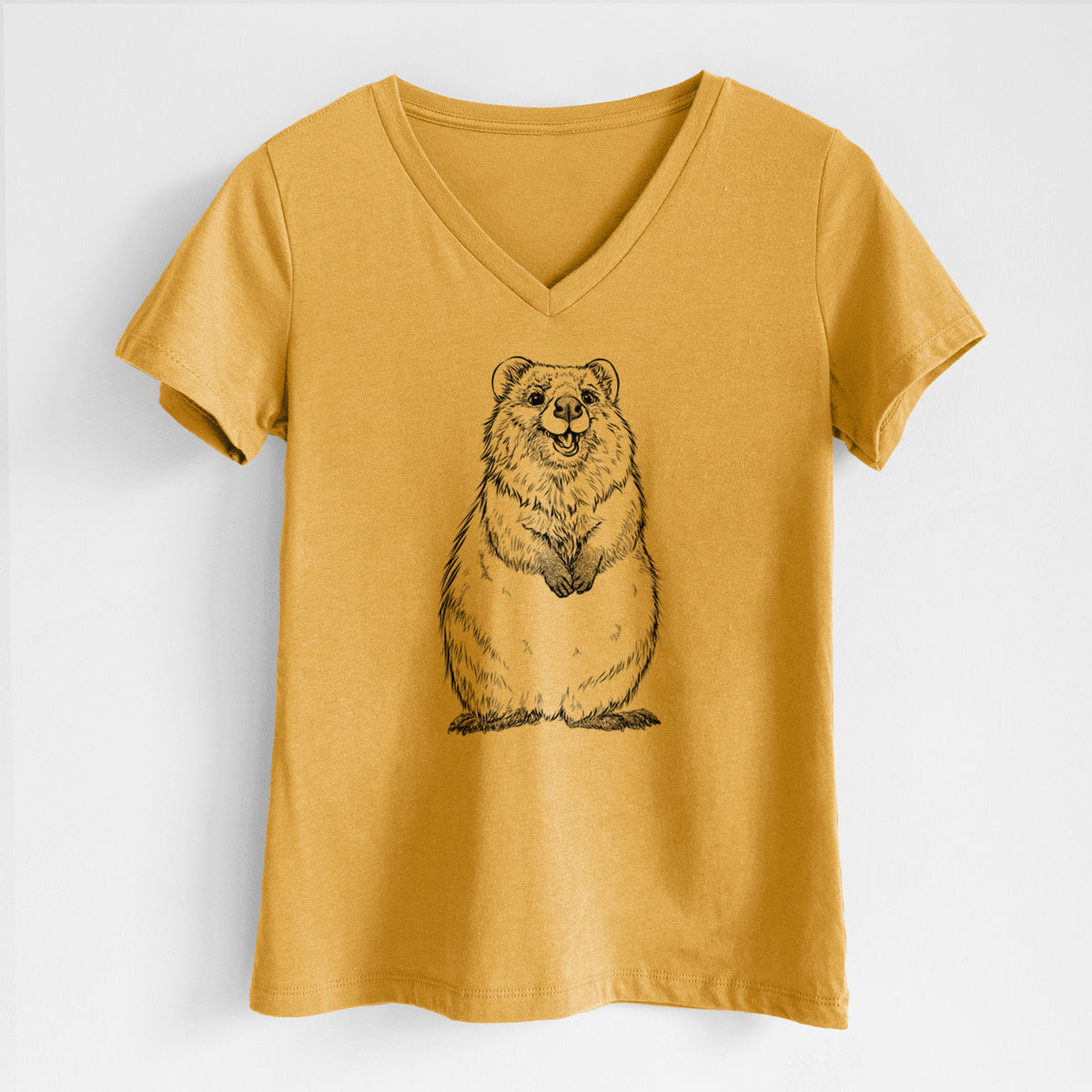 Honeycomb yellow women's relaxed fit cotton V-neck t-shirt laid flat, printed with a black ink illustration of a smiling quokka sitting upright.