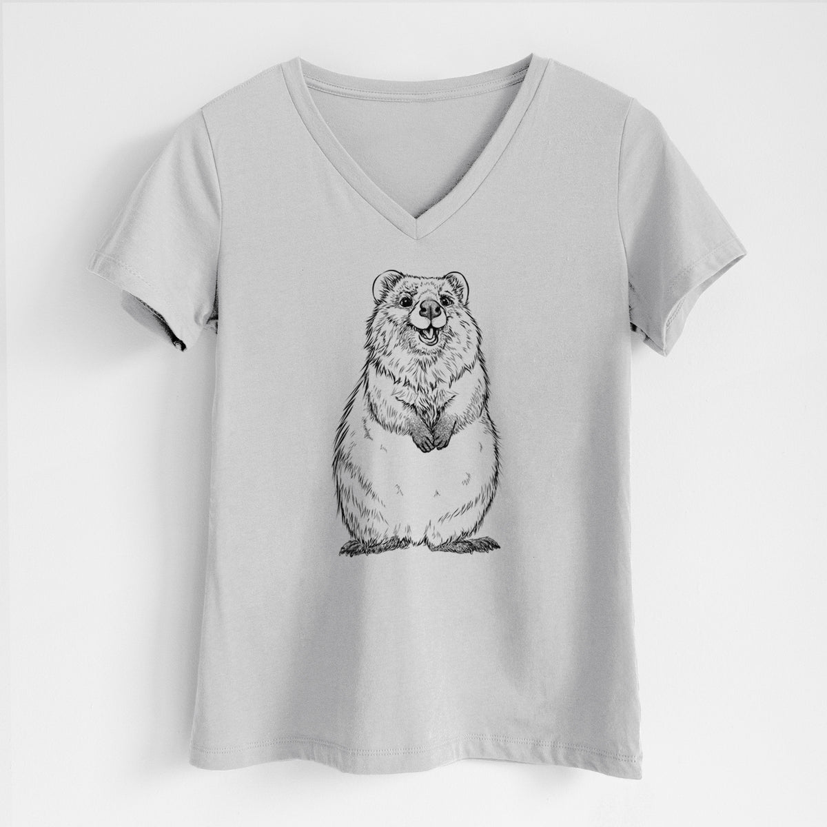 Lunar grey women's relaxed fit cotton V-neck t-shirt laid flat, printed with a black ink illustration of a smiling quokka sitting upright.