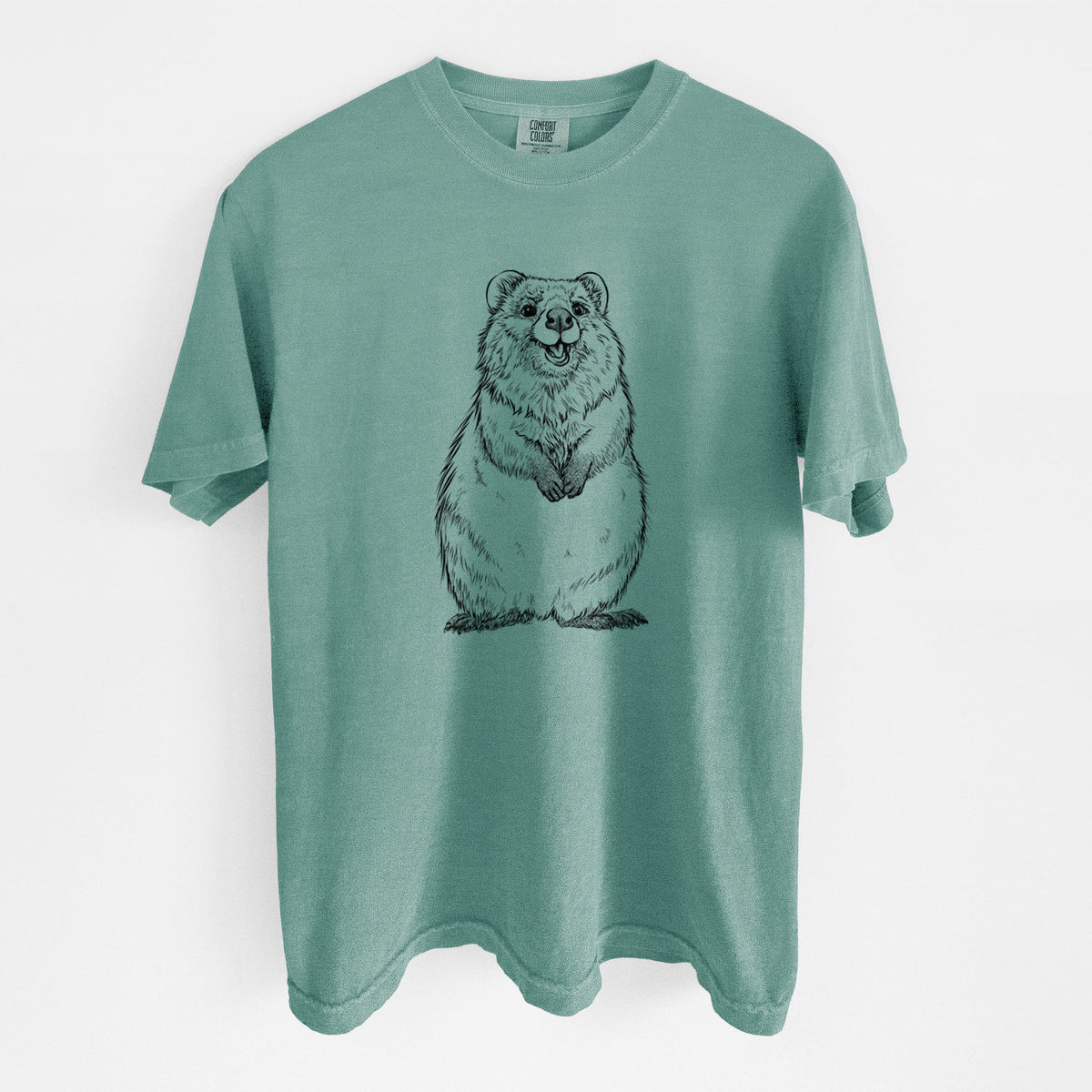 Reef green Comfort Colors t-shirt laid flat, printed with a black ink illustration of a smiling quokka sitting upright.
