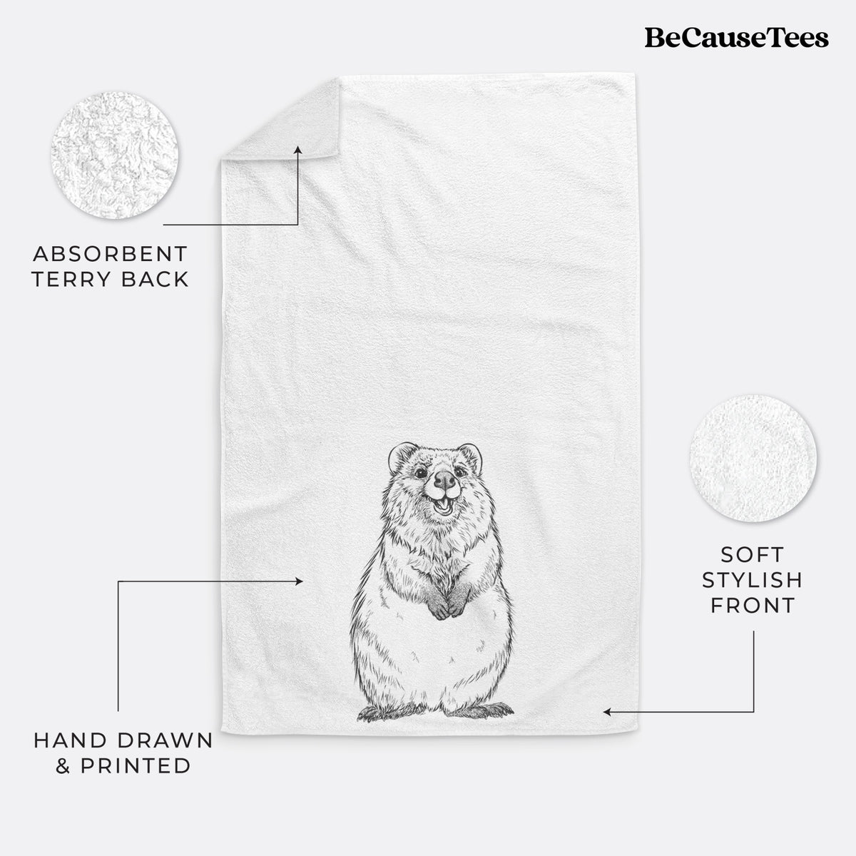 White hand towel printed with a black ink illustration of a smiling quokka sitting upright.