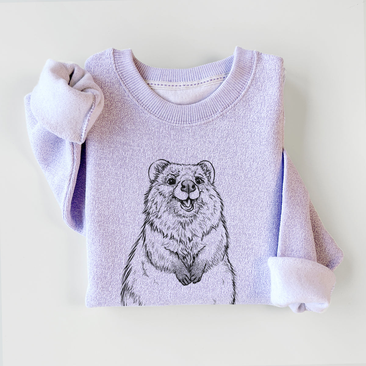 Ice purple knit sweatshirt printed with a black ink illustration of a smiling quokka sitting upright, styled flat.
