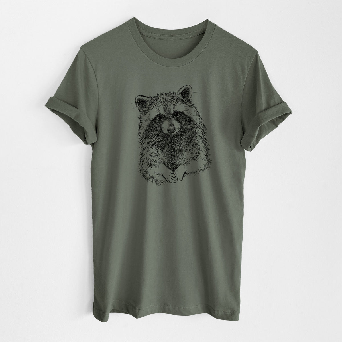 Military green lightweight cotton t-shirt laid flat, printed with a detailed black ink portrait of a raccoon with its front paws resting in front of it.
