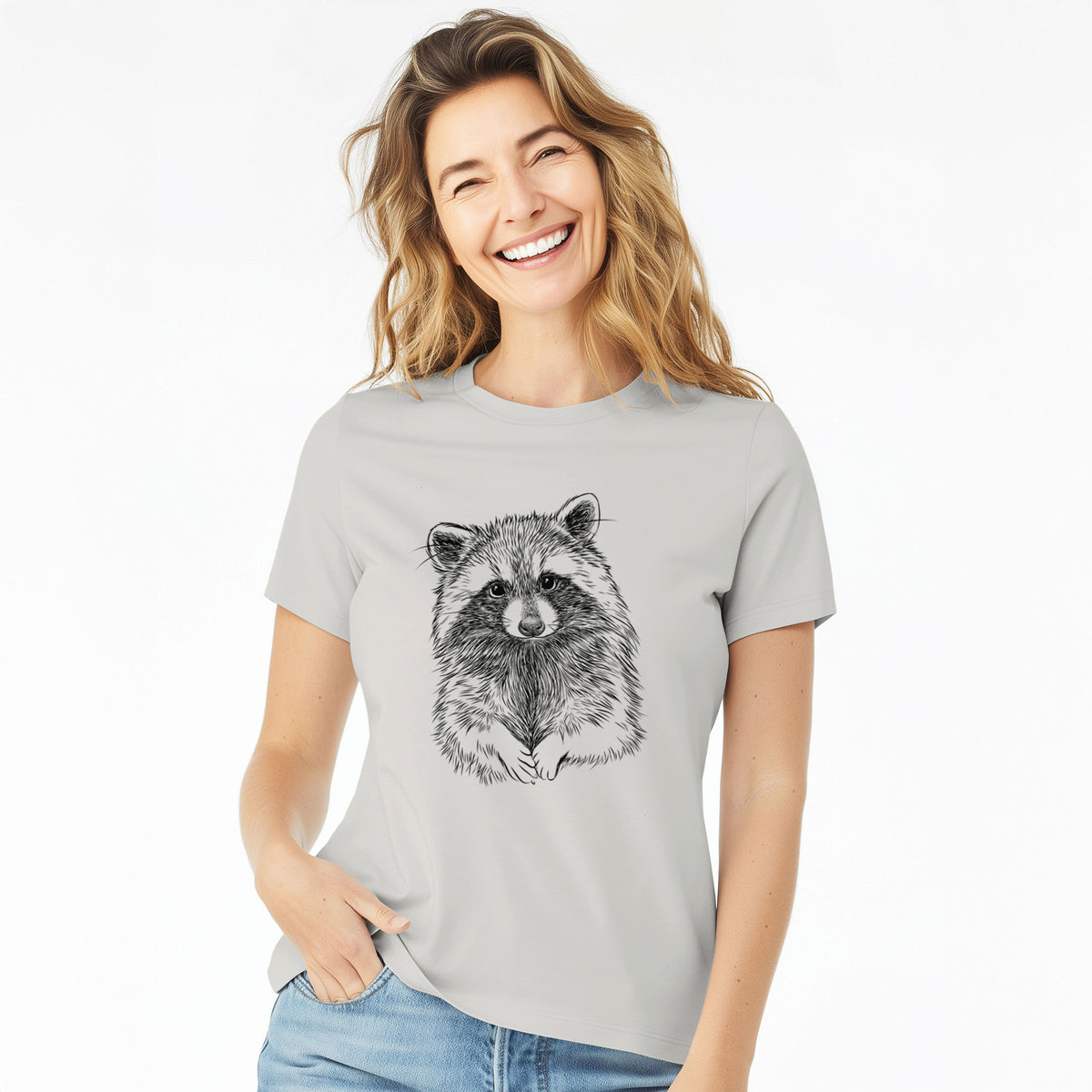 Woman wearing a lunar grey women's relaxed fit cotton t-shirt printed with a detailed black ink portrait of a raccoon with its front paws resting in front of it.