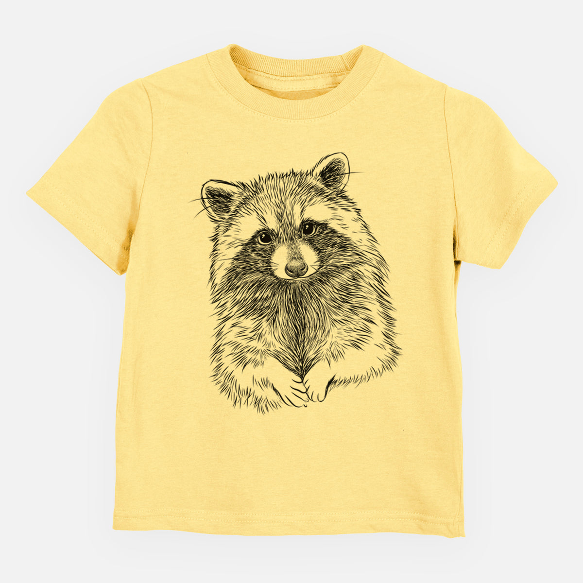 Butter yellow toddler t-shirt laid flat, printed with a detailed black ink portrait of a raccoon with its front paws resting in front of it.