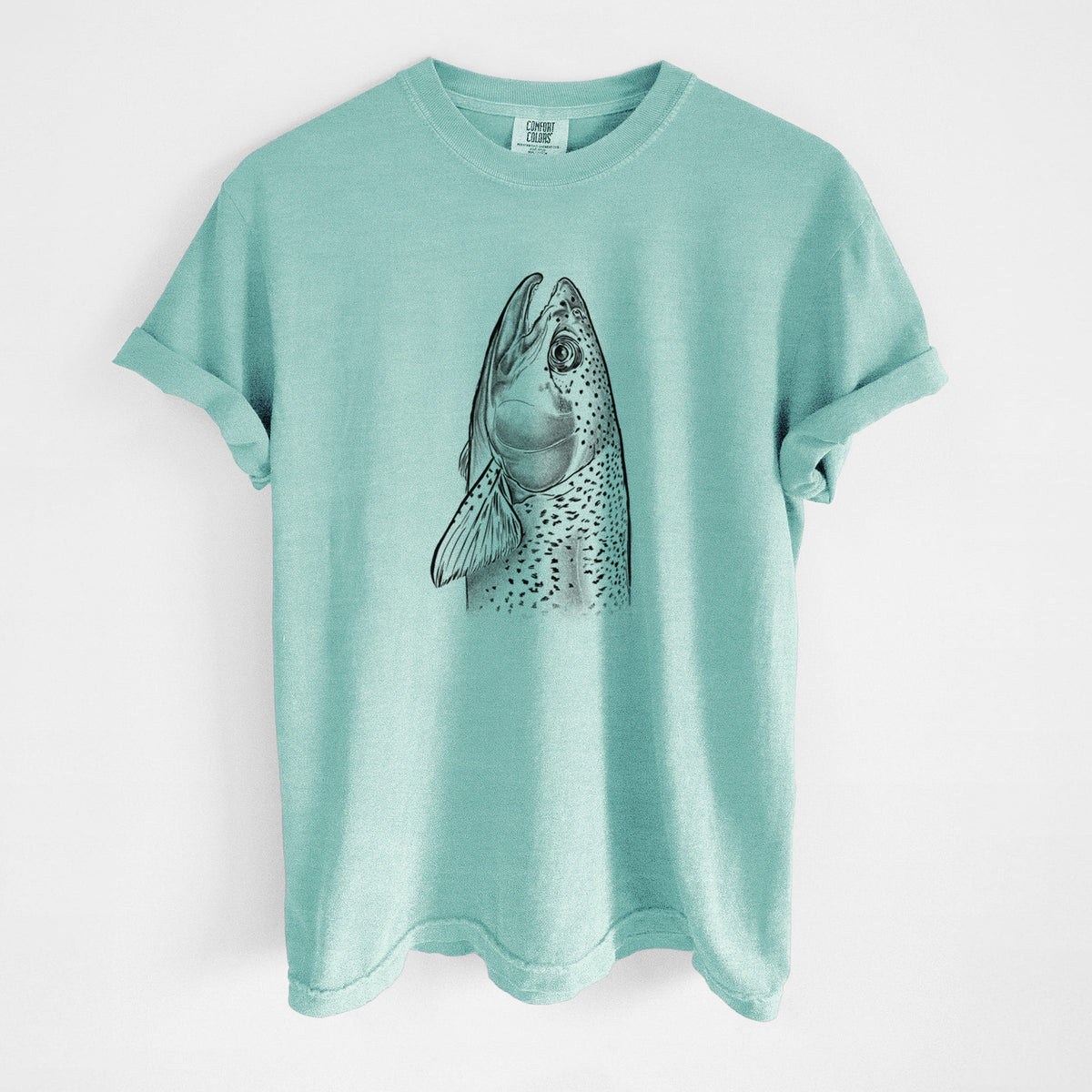 Chalky mint Comfort Colors t-shirt laid flat, printed with a detailed black ink illustration of a rainbow trout's head pointing upward, showing its spotted scales.