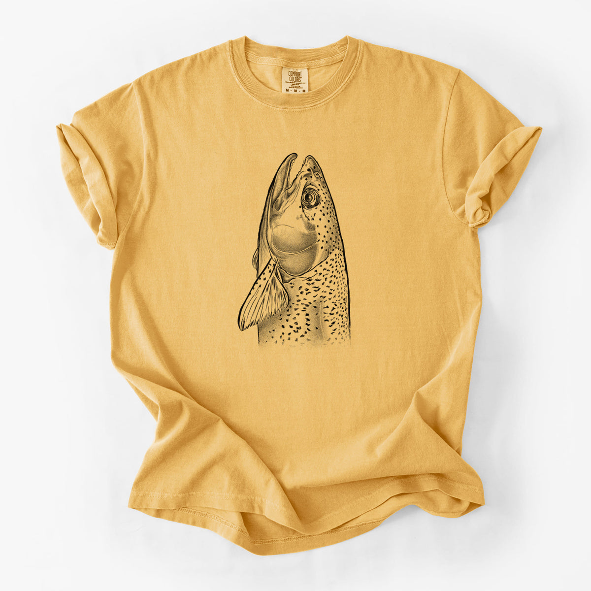 Golden wheat yellow Comfort Colors t-shirt laid flat, printed with a detailed black ink illustration of a rainbow trout's head pointing upward, showing its spotted scales.