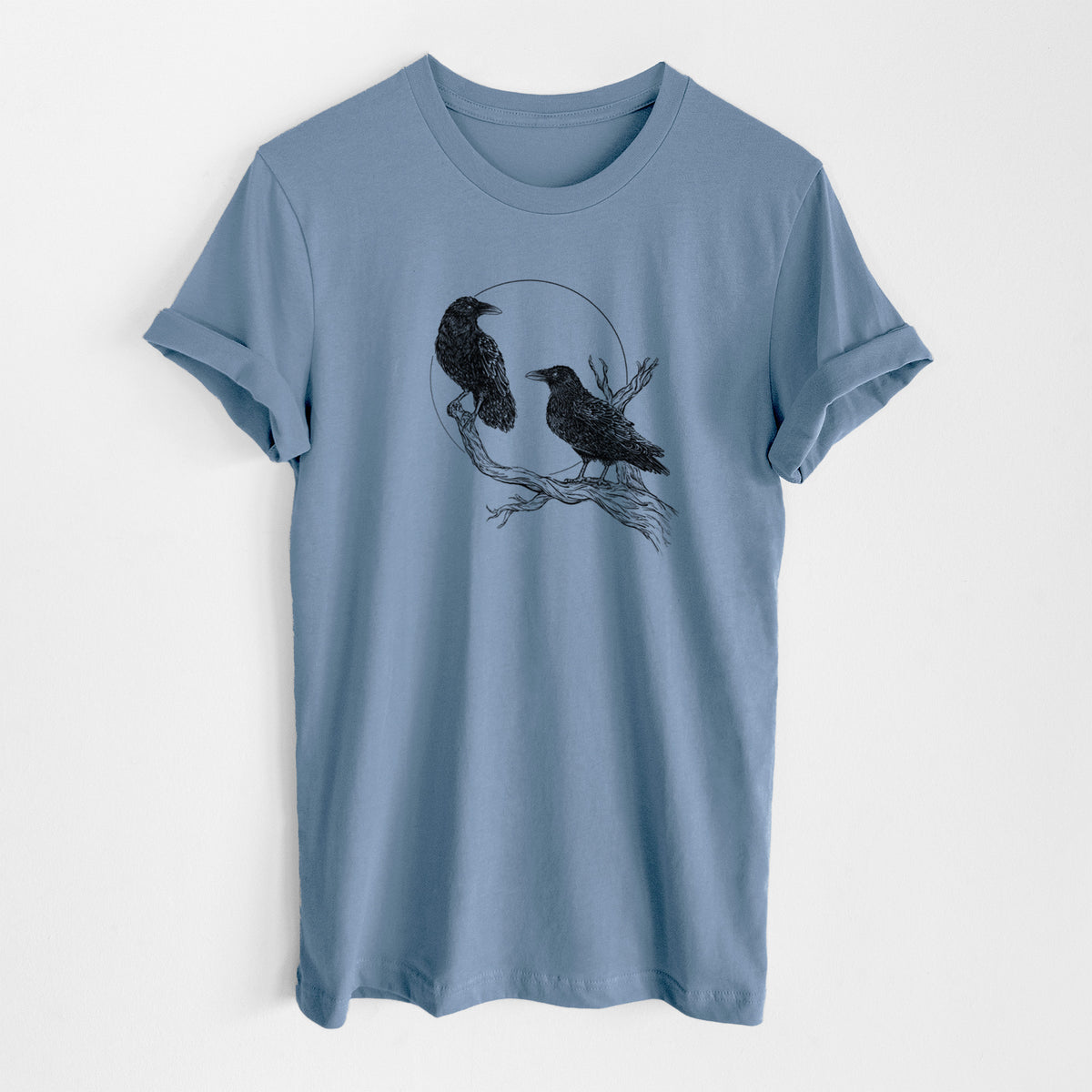 Steel blue lightweight cotton t-shirt laid flat, printed with a black ink illustration of two ravens perched on a branch in front of a full moon.