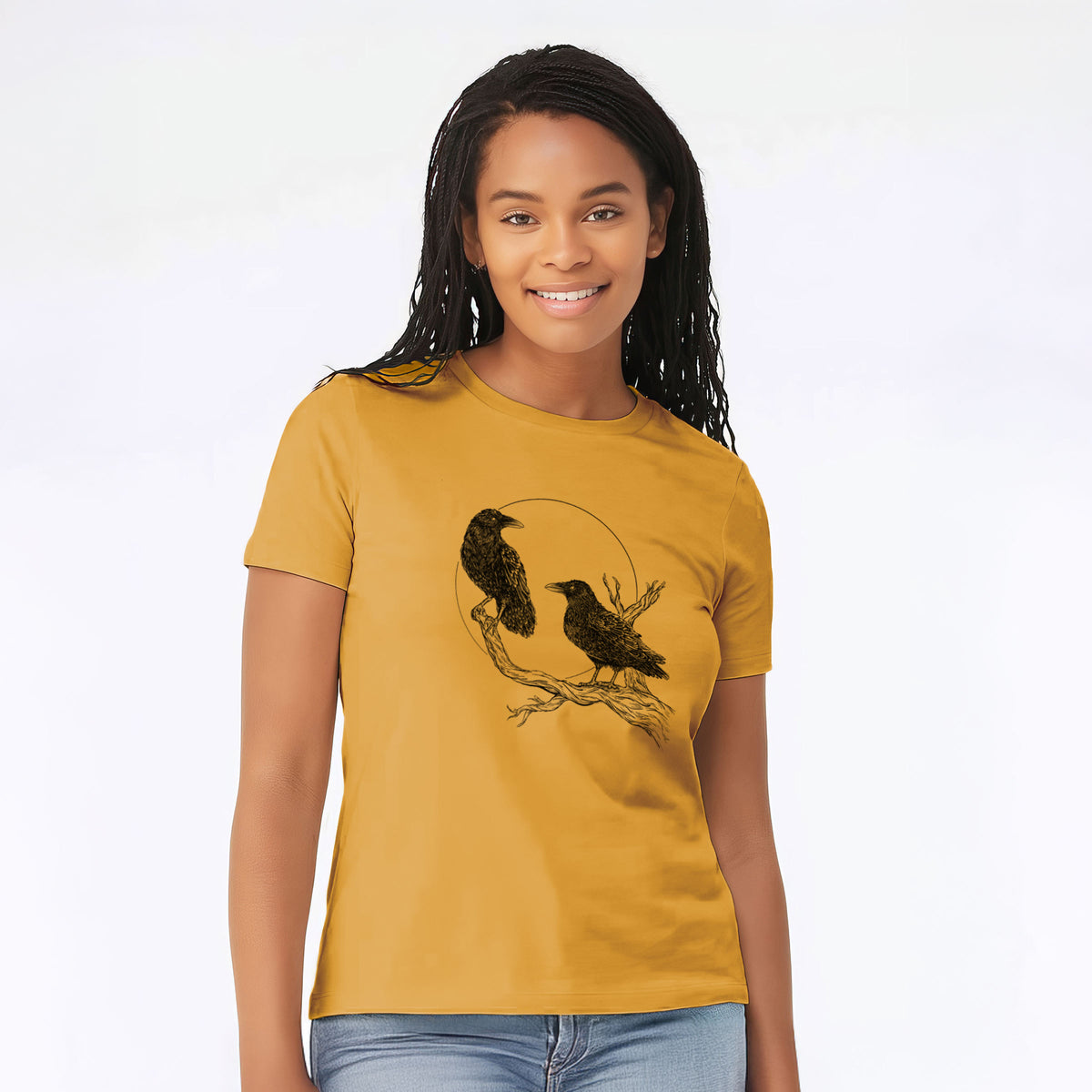 Woman wearing a honeycomb yellow women's relaxed fit cotton t-shirt printed with a black ink illustration of two ravens perched on a branch in front of a full moon.