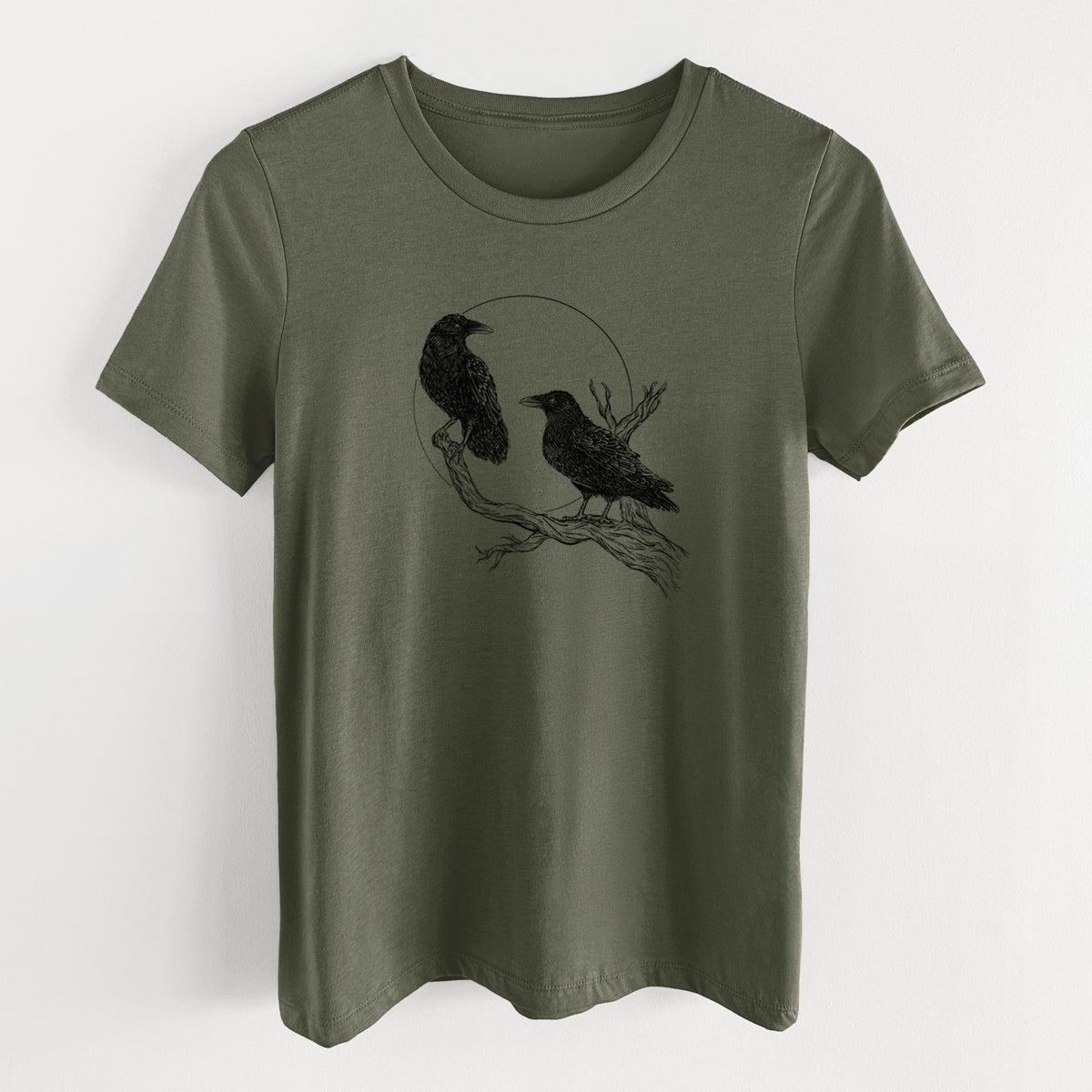 Military green women's relaxed fit cotton t-shirt laid flat, printed with a black ink illustration of two ravens perched on a branch in front of a full moon.