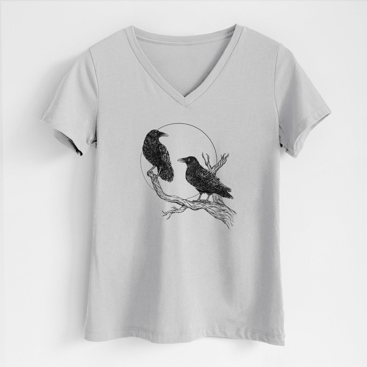 Lunar grey women's relaxed fit cotton V-neck t-shirt laid flat, printed with a black ink illustration of two ravens perched on a branch in front of a full moon.