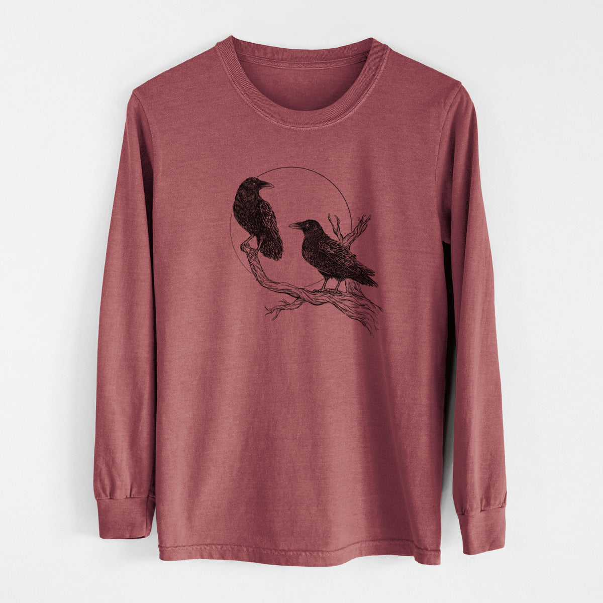 Brick red Comfort Colors long sleeve shirt laid flat, printed with a black ink illustration of two ravens perched on a branch in front of a full moon.