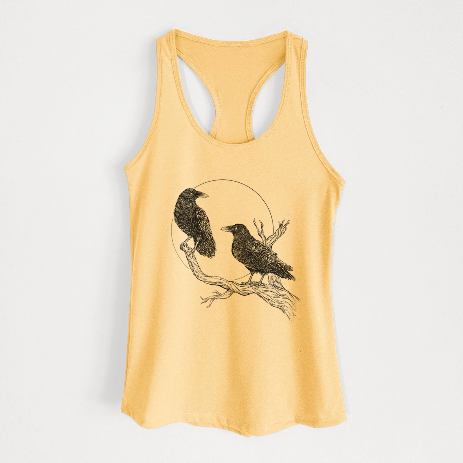 Banana cream women's racerback tank top laid flat, printed with a black ink illustration of two ravens perched on a branch in front of a full moon.