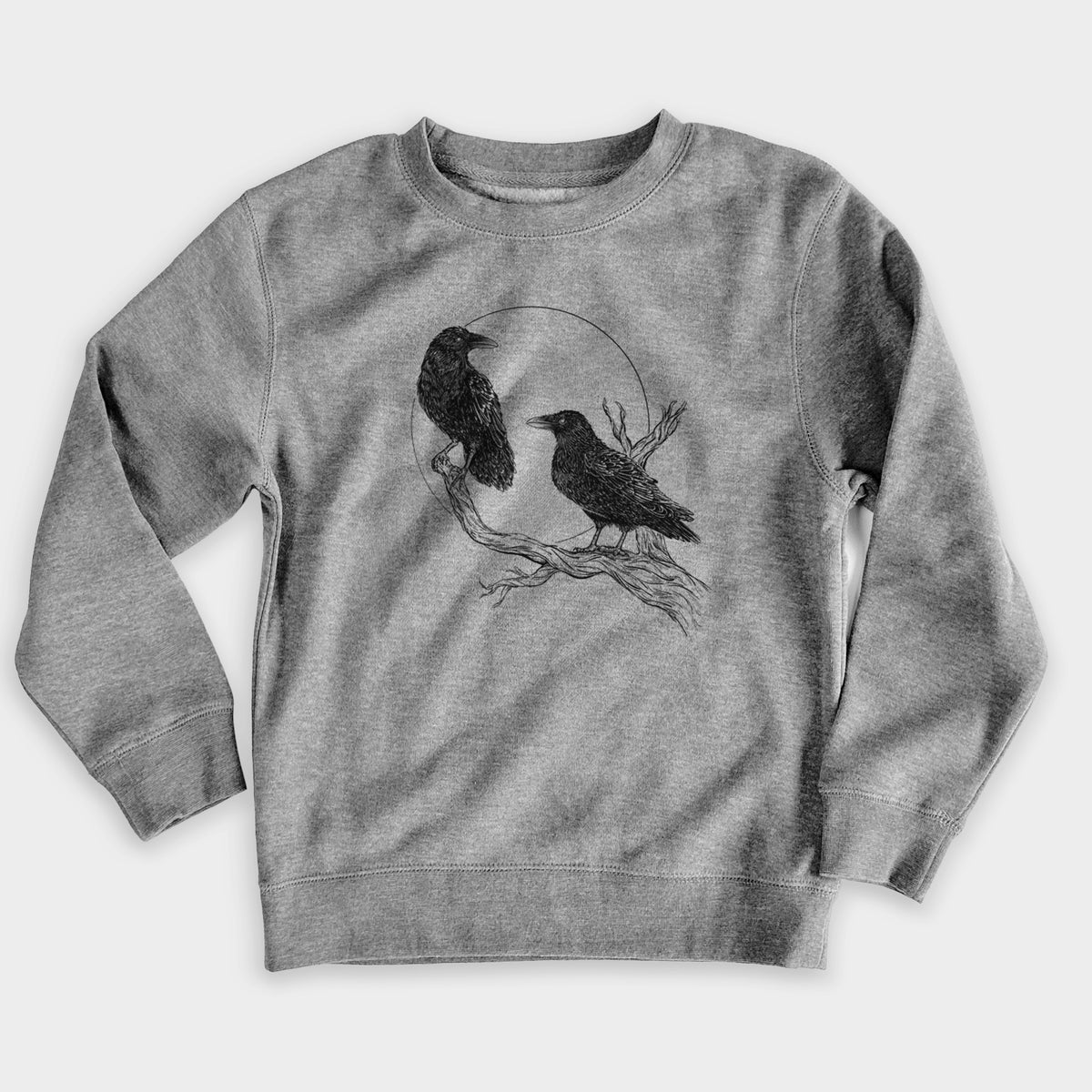 Nickel grey youth crewneck sweatshirt laid flat, printed with a black ink illustration of two ravens perched on a branch in front of a full moon.