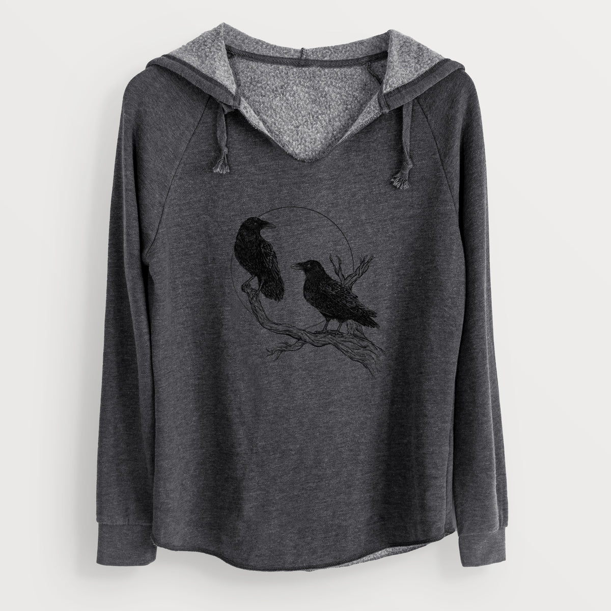 Charcoal grey women's Cali Wave hooded sweatshirt laid flat, printed with a black ink illustration of two ravens perched on a branch in front of a full moon.