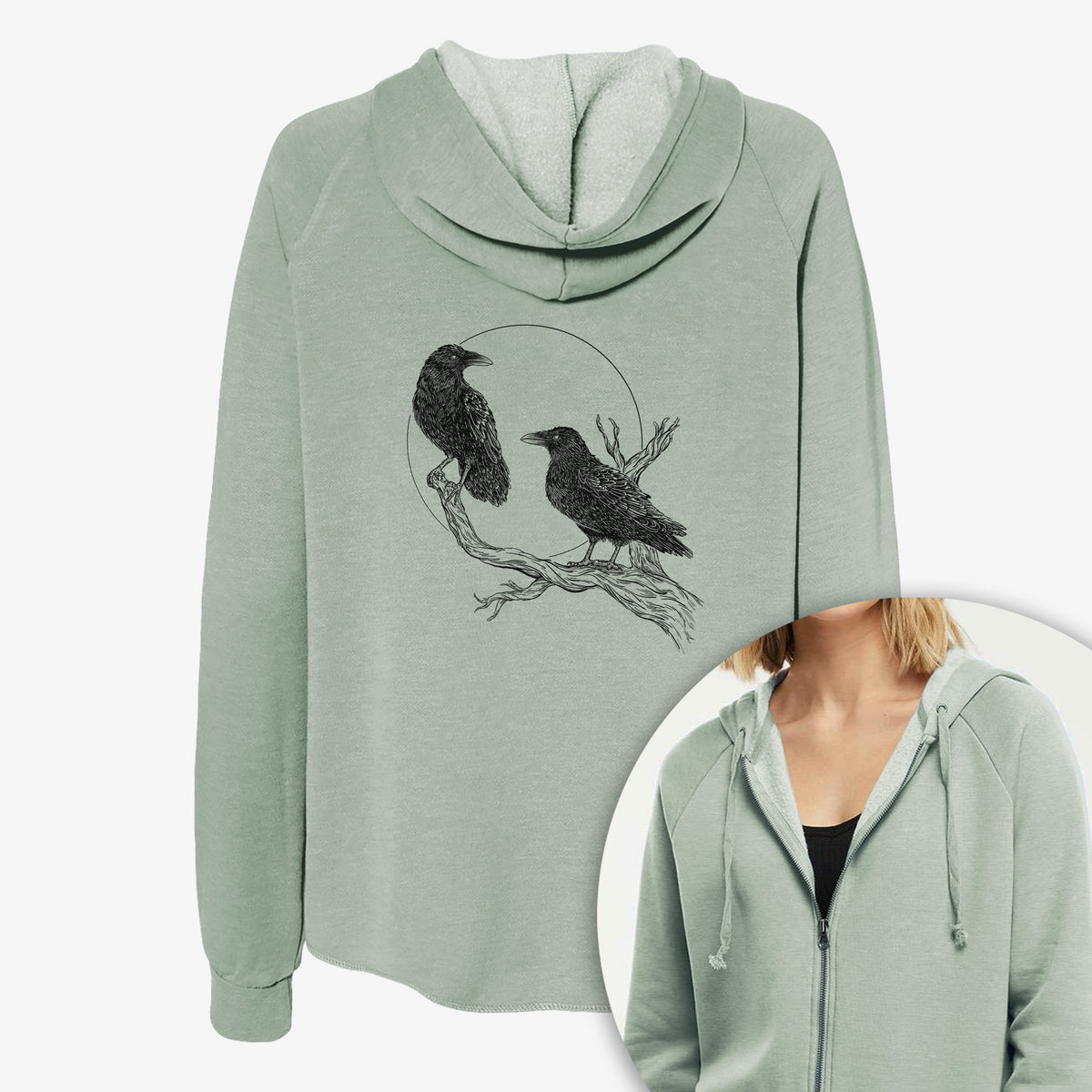 Women's Cali Wave zip-up sweatshirt printed with a black ink illustration of two ravens perched on a branch in front of a full moon, with a close-up of the zipper.