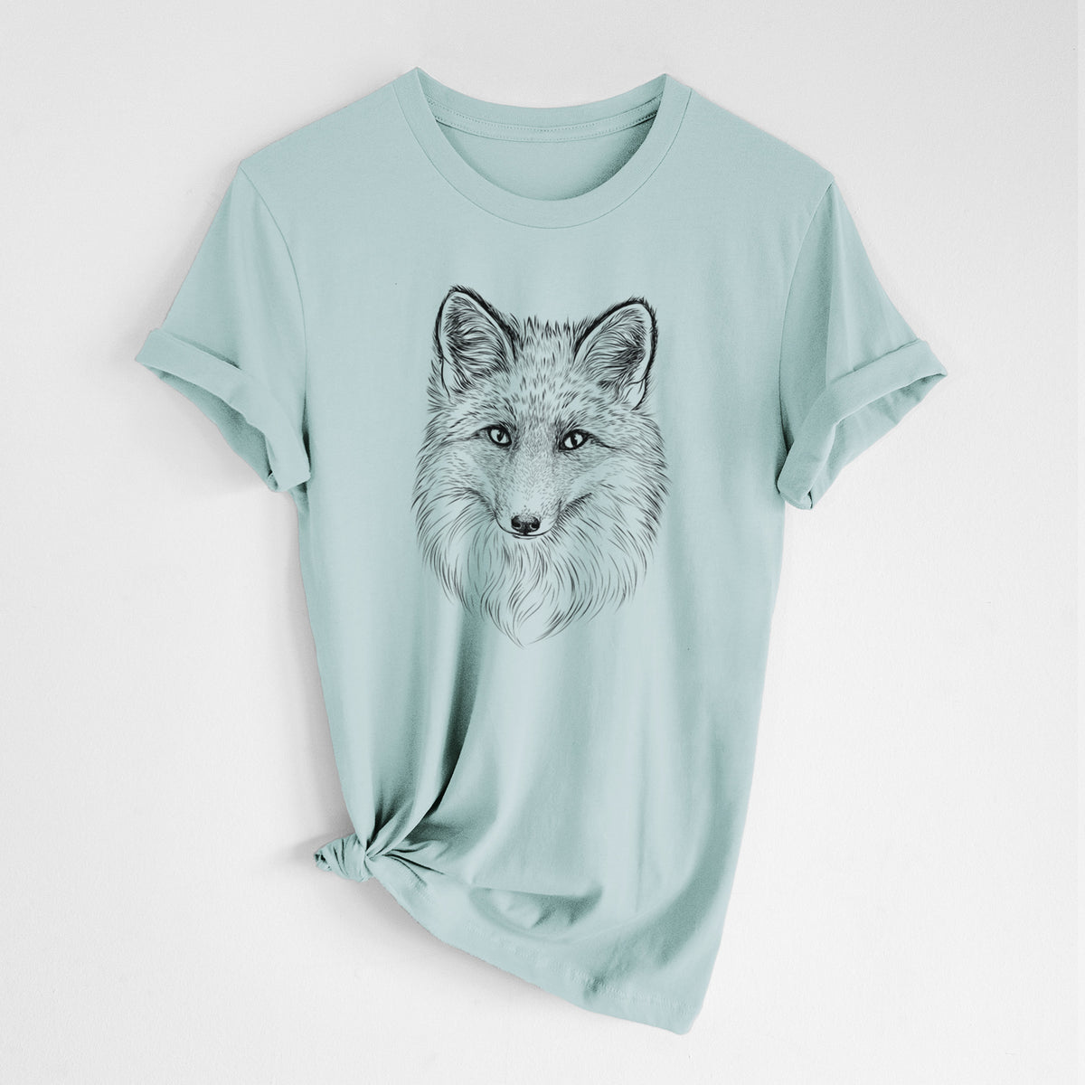 Dusty blue lightweight cotton t-shirt laid flat with the sleeves rolled, printed with a detailed black ink sketch of a red fox's face looking straight ahead, its fur drawn in fine pencil-like strokes.
