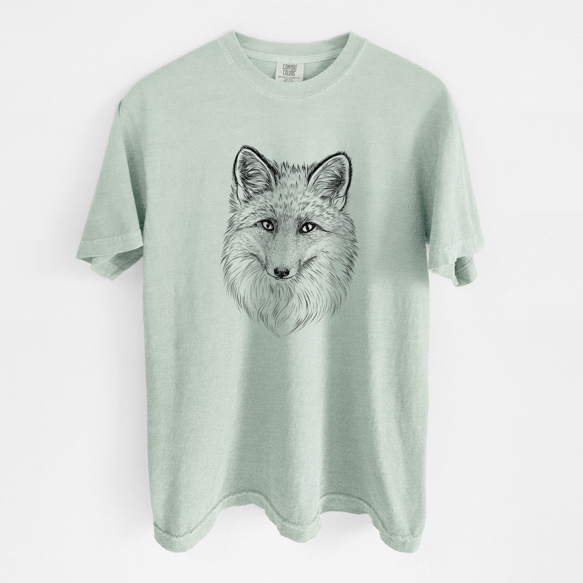 Bay green Comfort Colors t-shirt laid flat, printed with a detailed black ink sketch of a red fox's face looking straight ahead, its fur drawn in fine pencil-like strokes.
