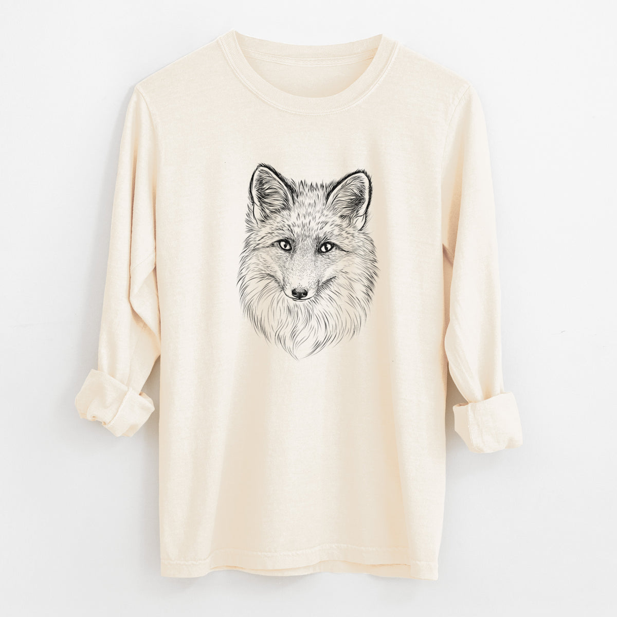 Ivory Comfort Colors long sleeve shirt laid flat with the cuffs rolled, printed with a detailed black ink sketch of a red fox's face looking straight ahead, its fur drawn in fine pencil-like strokes.