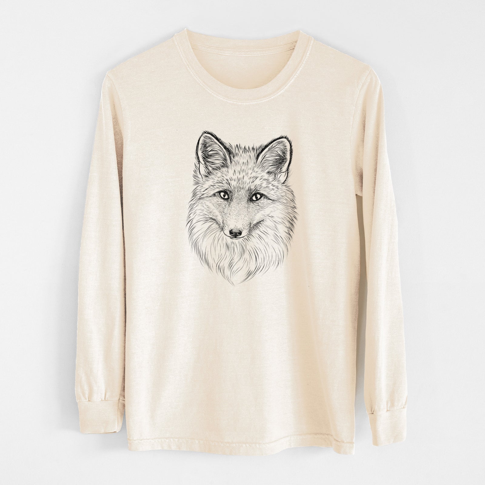 Ivory Comfort Colors long sleeve shirt laid flat, printed with a detailed black ink sketch of a red fox's face looking straight ahead, its fur drawn in fine pencil-like strokes.