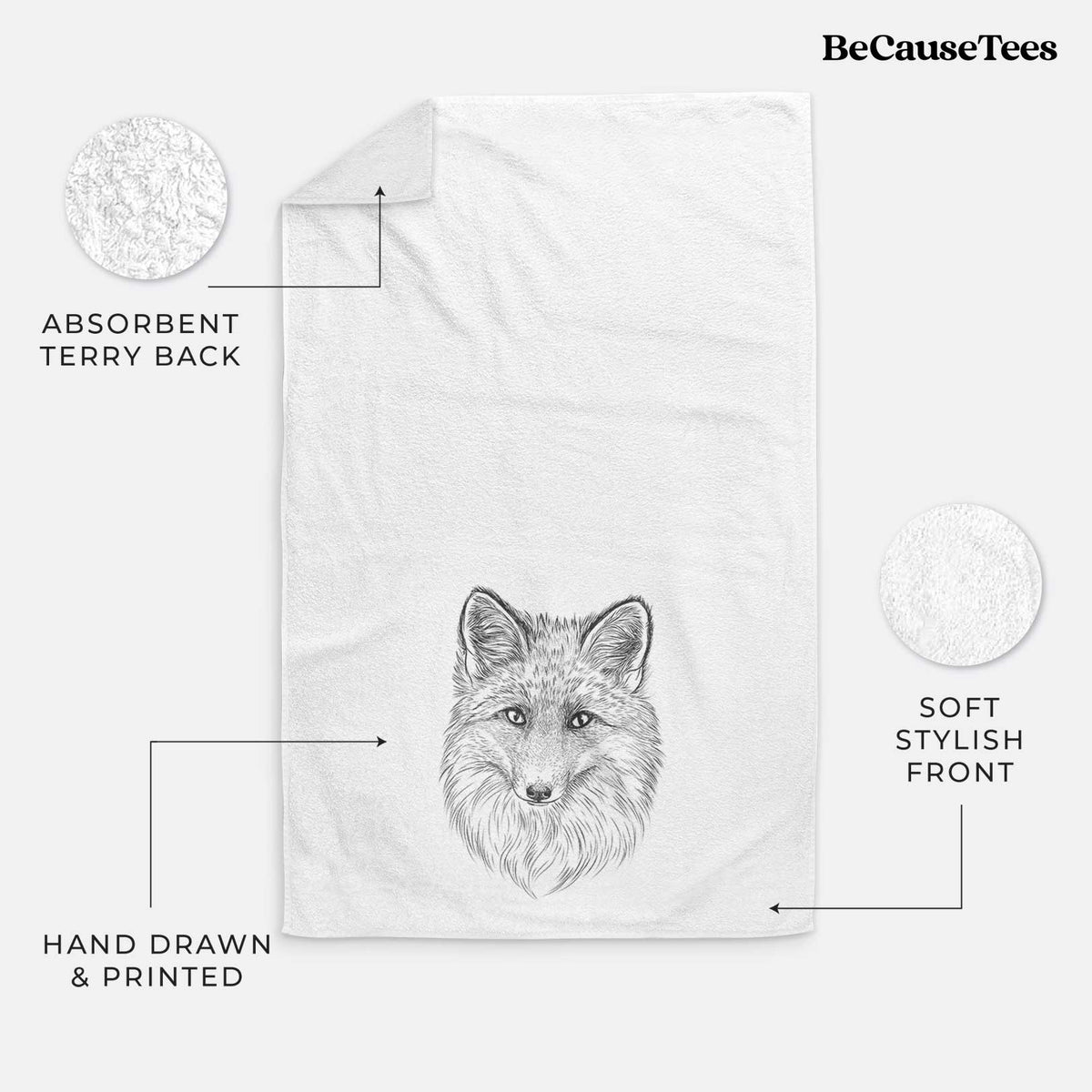White hand towel printed with a detailed black ink sketch of a red fox's face looking straight ahead, its fur drawn in fine pencil-like strokes.