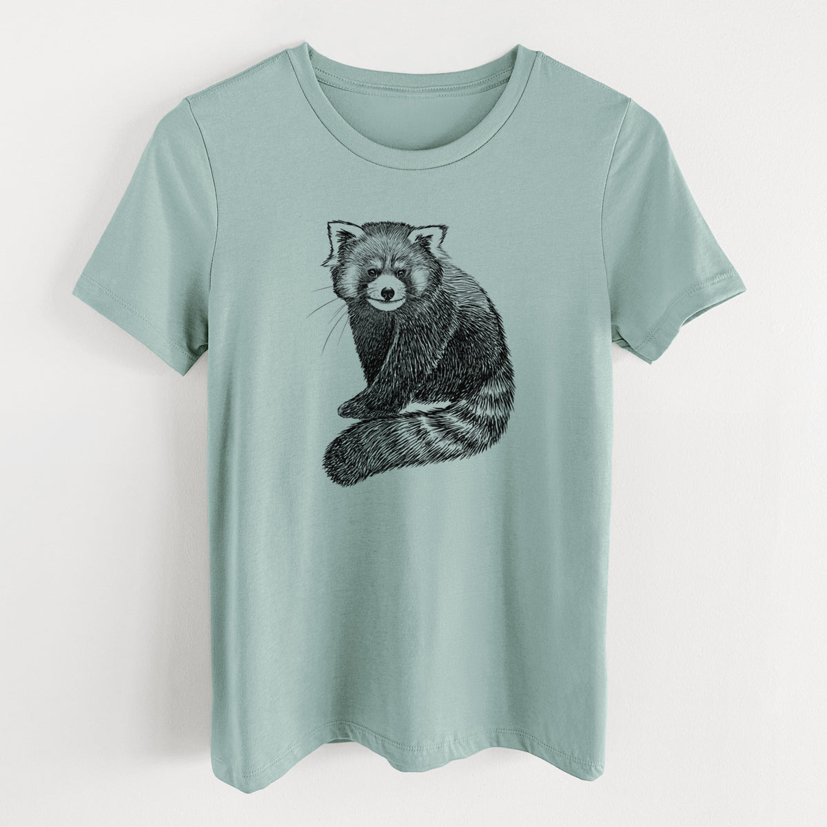 Dusty blue women's relaxed fit cotton t-shirt laid flat, printed with a detailed black ink illustration of a red panda sitting with its striped tail wrapped around.