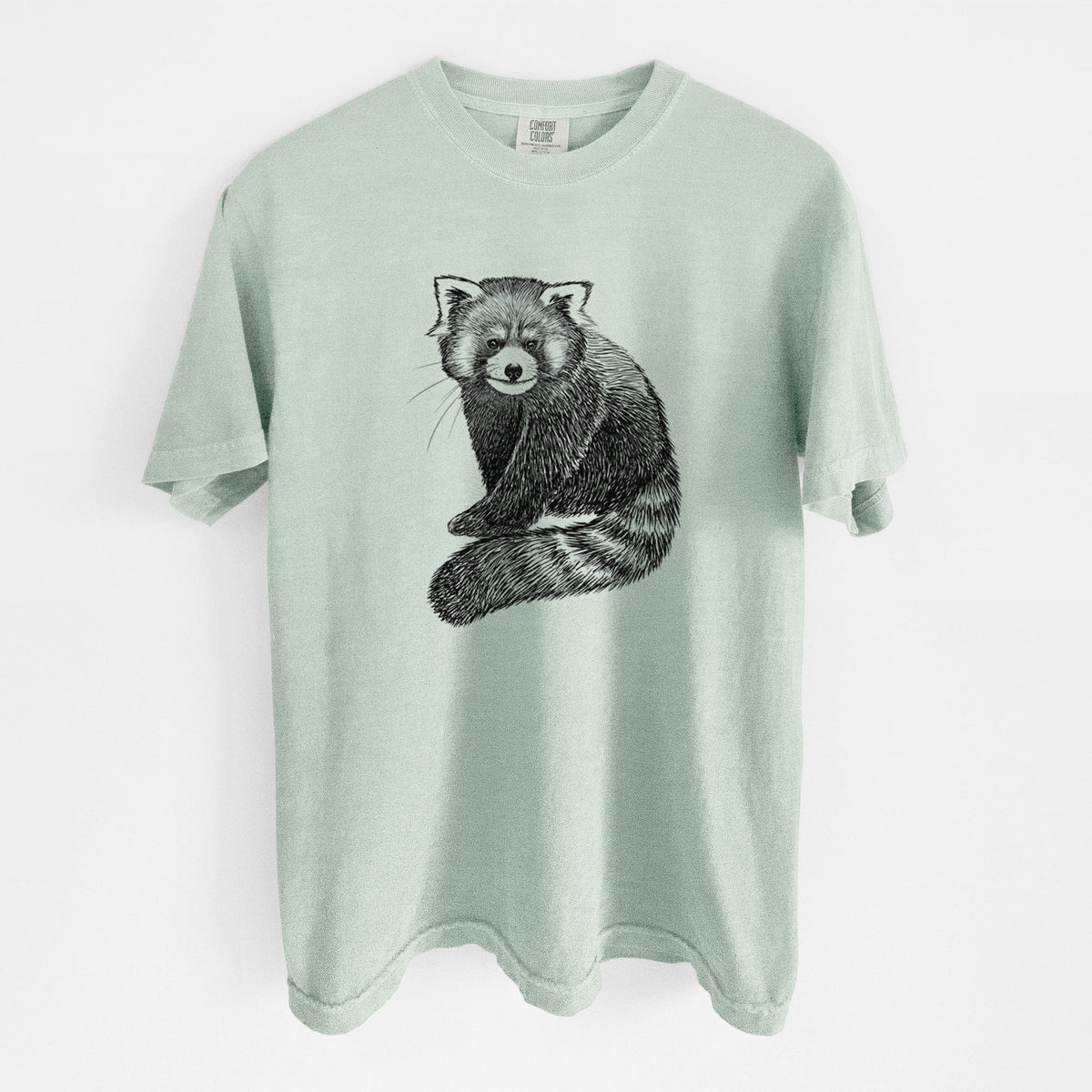 Bay green Comfort Colors t-shirt laid flat, printed with a detailed black ink illustration of a red panda sitting with its striped tail wrapped around.