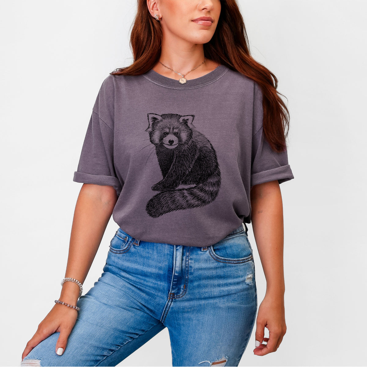 Woman wearing a Comfort Colors t-shirt printed with a detailed black ink illustration of a red panda sitting with its striped tail wrapped around.