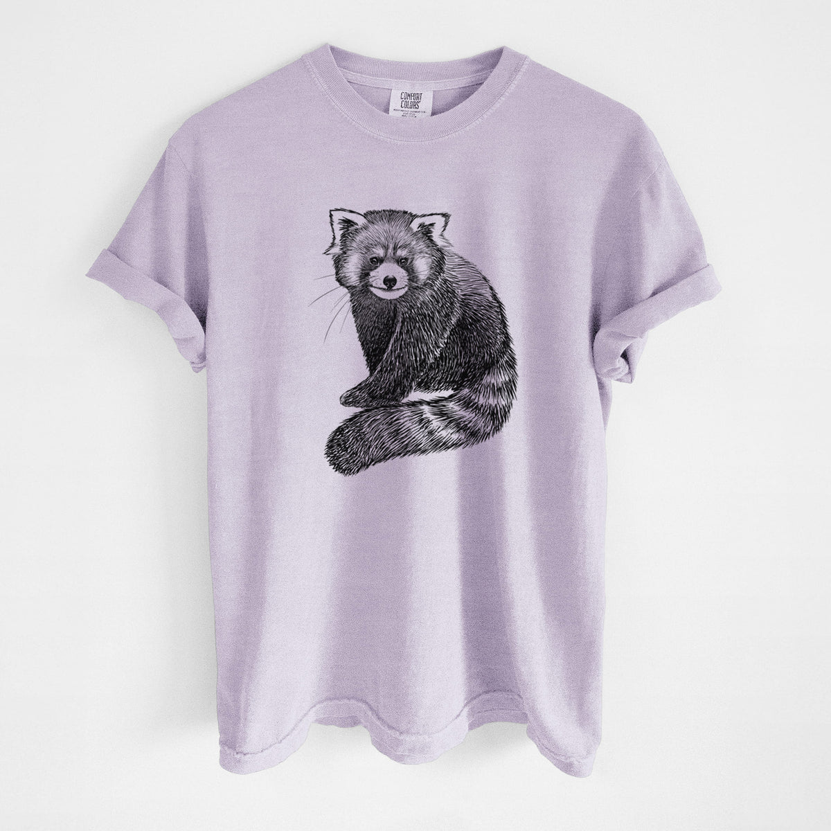 Orchid purple Comfort Colors t-shirt laid flat, printed with a detailed black ink illustration of a red panda sitting with its striped tail wrapped around.