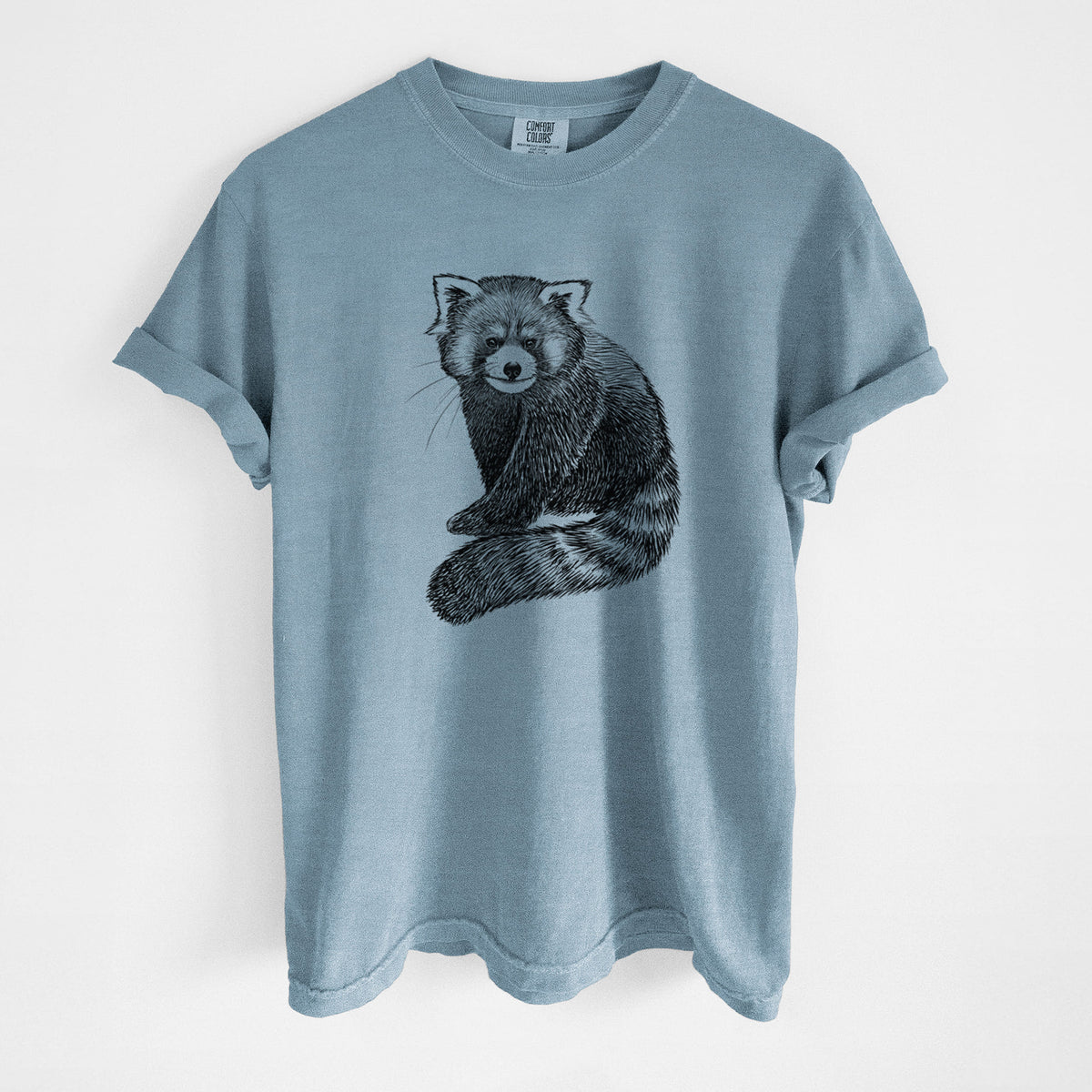 Steel blue Comfort Colors t-shirt laid flat, printed with a detailed black ink illustration of a red panda sitting with its striped tail wrapped around.