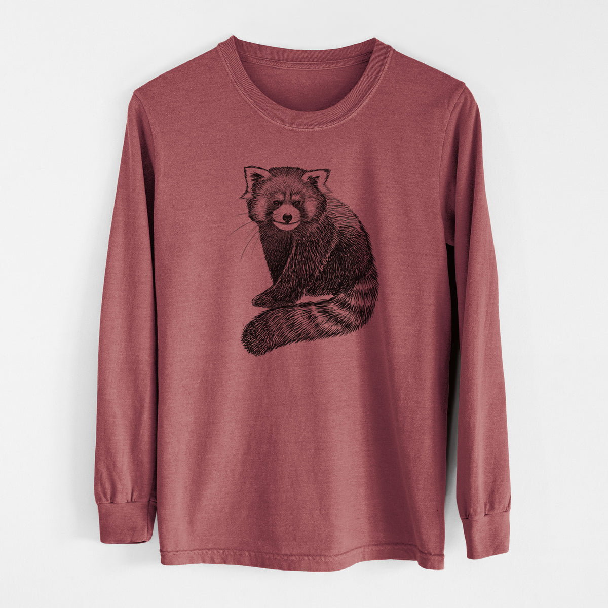 Brick red Comfort Colors long sleeve shirt laid flat, printed with a detailed black ink illustration of a red panda sitting with its striped tail wrapped around.