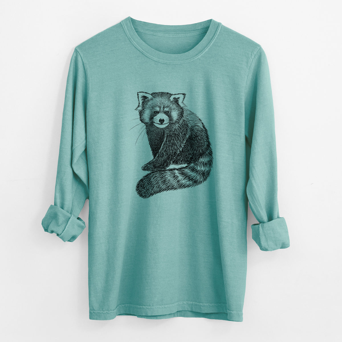 Reef green Comfort Colors long sleeve shirt laid flat with the cuffs rolled, printed with a detailed black ink illustration of a red panda sitting with its striped tail wrapped around.