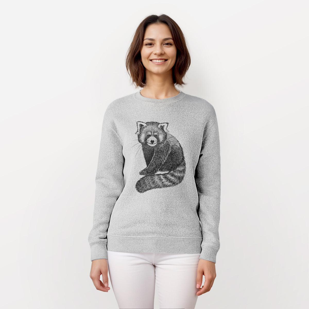 Woman wearing a knit sweatshirt printed with a detailed black ink illustration of a red panda sitting with its striped tail wrapped around.