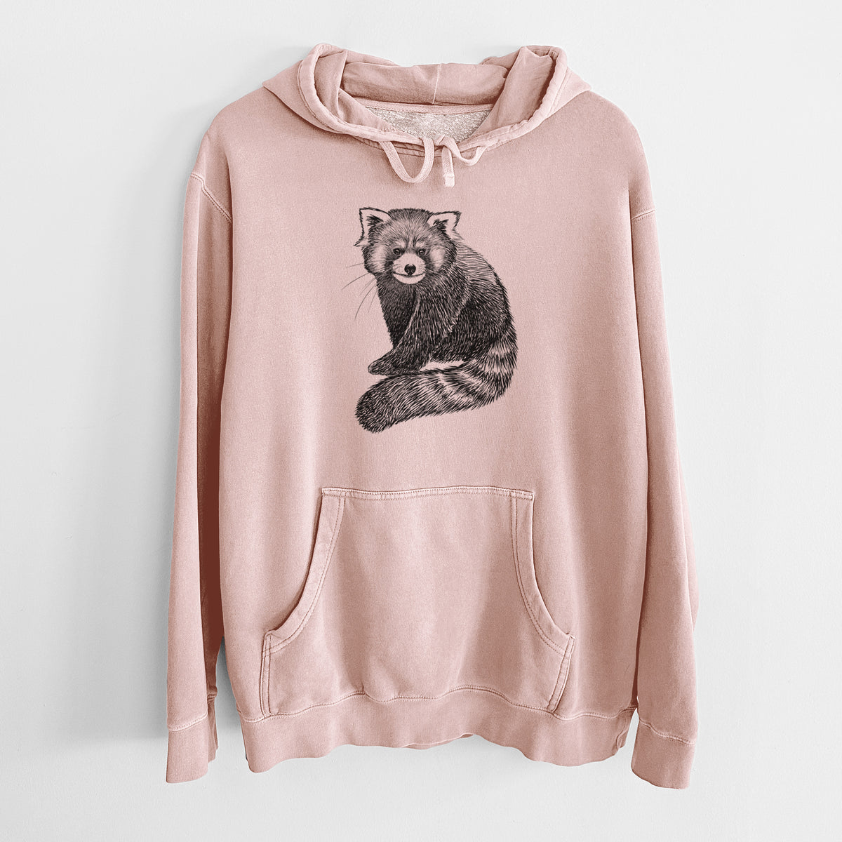 Dusty pink pigment dyed hoodie laid flat, printed with a detailed black ink illustration of a red panda sitting with its striped tail wrapped around.