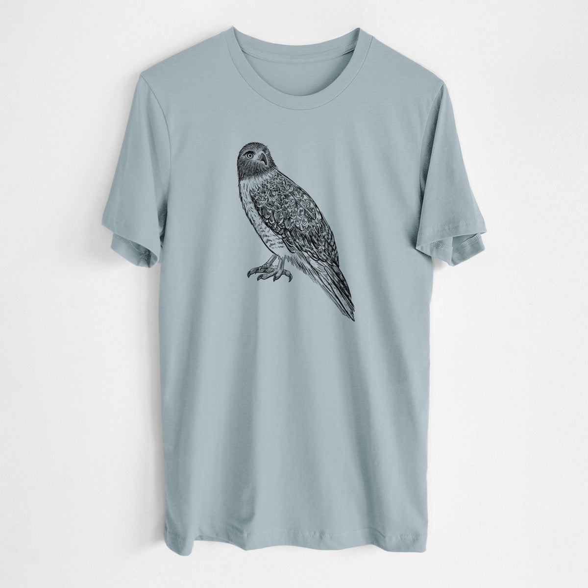 Vintage denim lightweight cotton t-shirt laid flat, printed with a detailed black ink illustration of a red-tailed hawk perched.