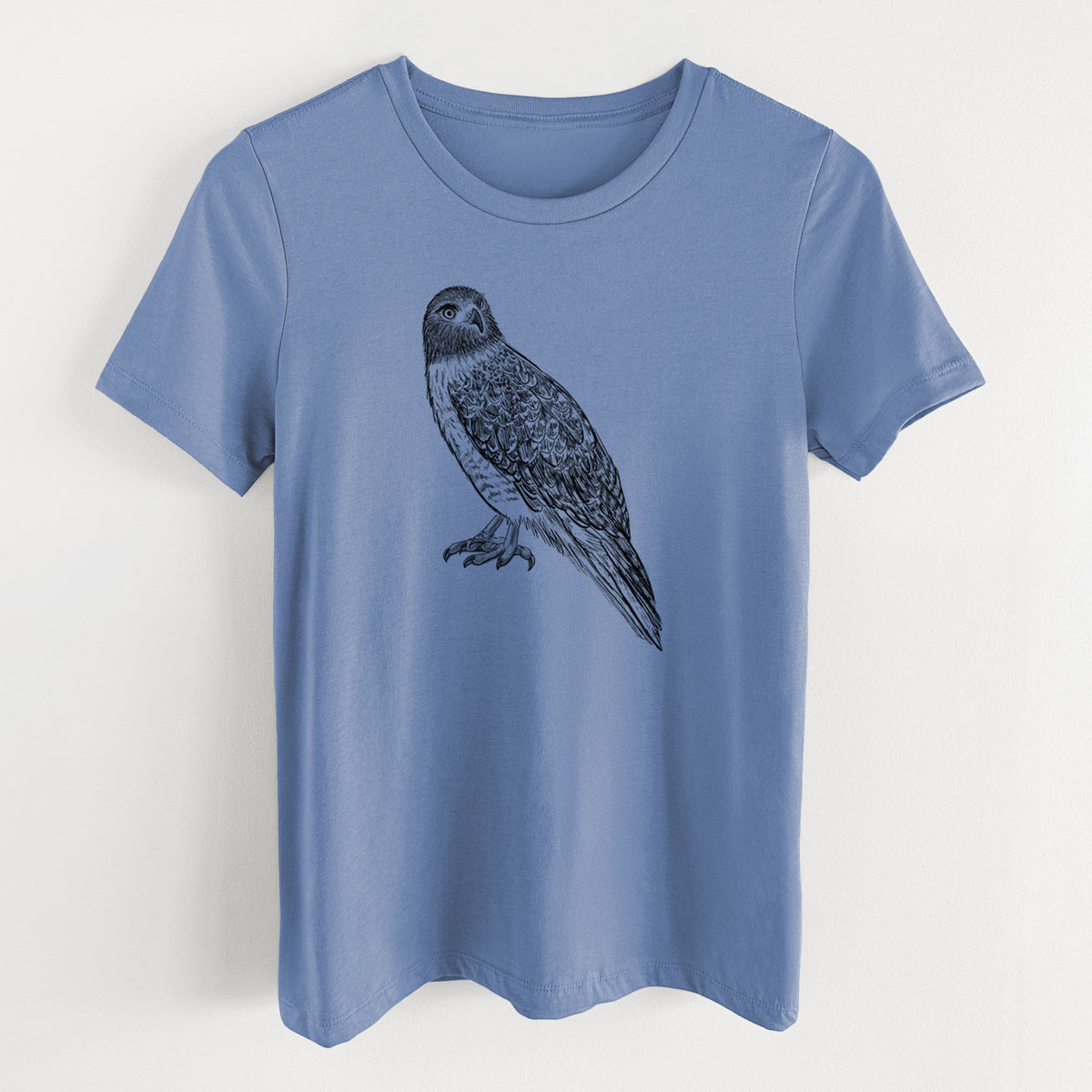 Blue bell women's relaxed fit cotton t-shirt laid flat, printed with a detailed black ink illustration of a red-tailed hawk perched.
