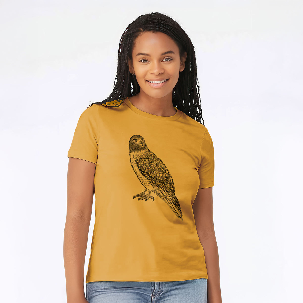Woman wearing a mustard yellow women's relaxed fit cotton t-shirt printed with a detailed black ink illustration of a red-tailed hawk perched.