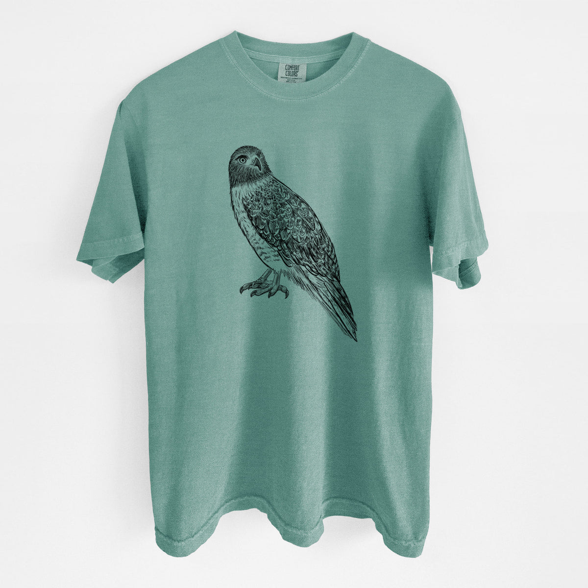 Reef green Comfort Colors t-shirt laid flat, printed with a detailed black ink illustration of a red-tailed hawk perched.