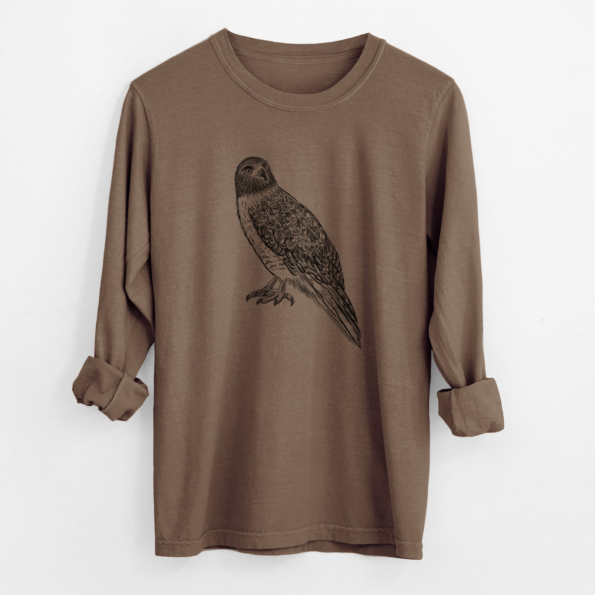 Espresso brown Comfort Colors long sleeve shirt laid flat with the cuffs rolled, printed with a detailed black ink illustration of a red-tailed hawk perched.