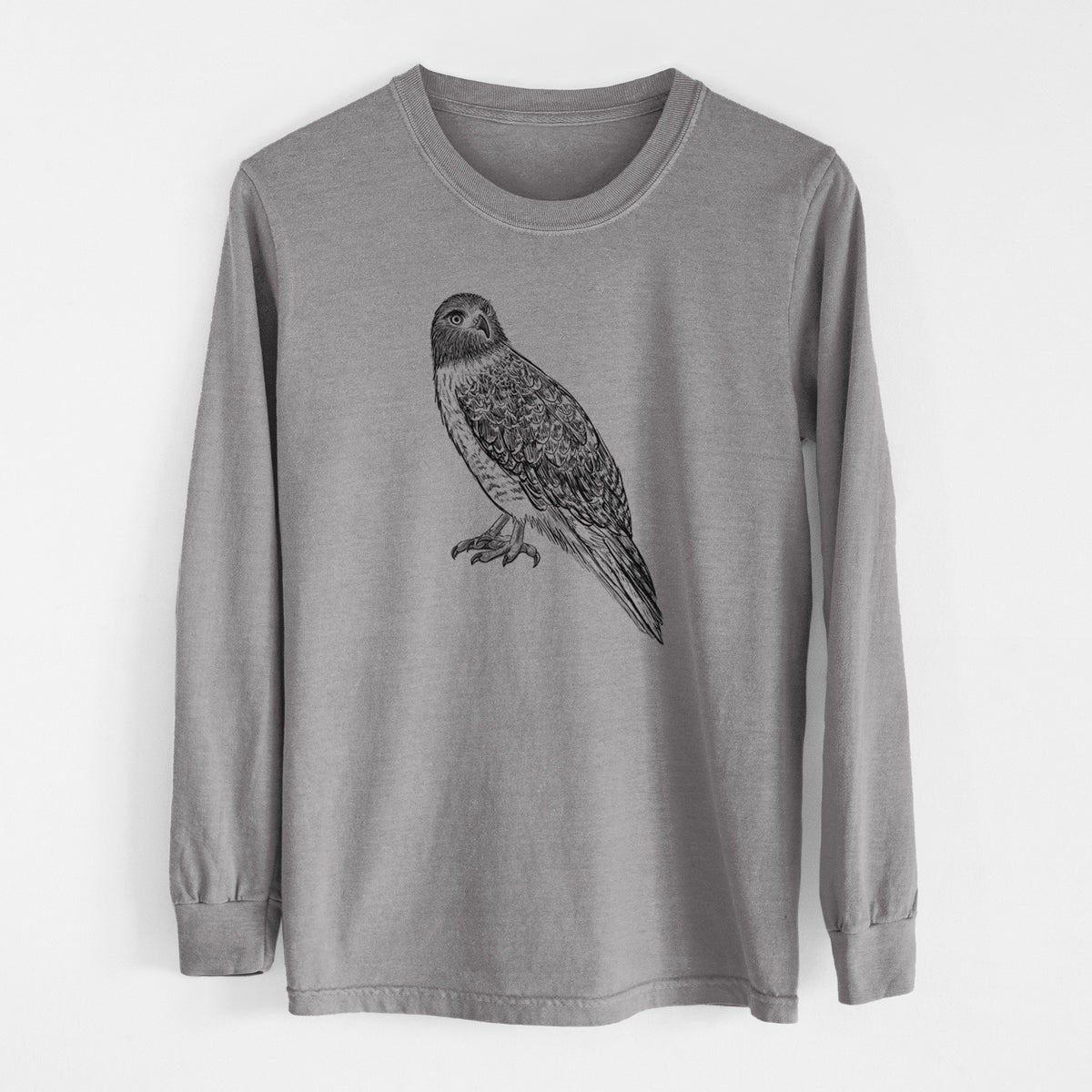 Grey Comfort Colors long sleeve shirt laid flat, printed with a detailed black ink illustration of a red-tailed hawk perched.