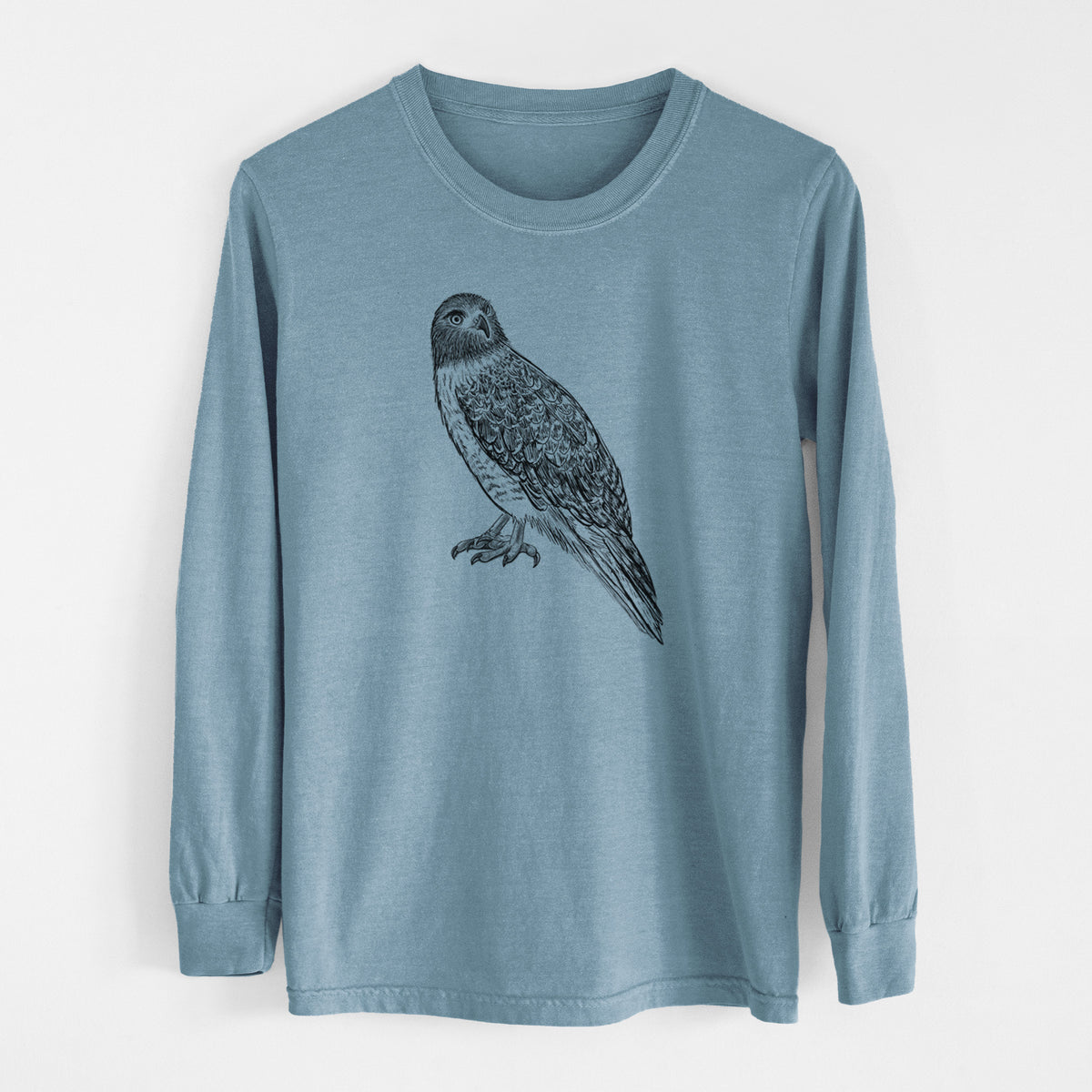 Steel blue Comfort Colors long sleeve shirt laid flat, printed with a detailed black ink illustration of a red-tailed hawk perched.
